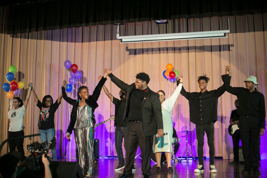 This Nov. 11, 2023 image provided by the Soulsville Foundation shows, from left, Stax Music Academy students Lauren Sanders, Pasley Thompson, Teiona Echols (holding hands with) Rickey Fondren, Joi Stubbs, Zander Henley, Johnathan Cole Jr. from the cast of "Stax Meets Motown." The online show to commemorate Black History Month features music from Memphis-based Stax Records and Detroit’s Motown. (Claire James/Soulsville Foundation via AP)