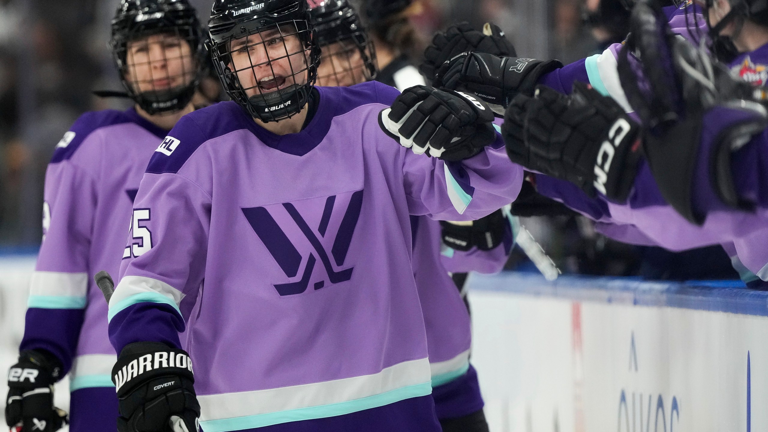 Team Kloss' Alex Carpenter (25) celebrates a goal while playing against Team King during the PWHL 3-on-3 Showcase at the NHL All-Star hockey week in Toronto on Thursday, Feb. 1, 2024. (Frank Gunn/The Canadian Press via AP)