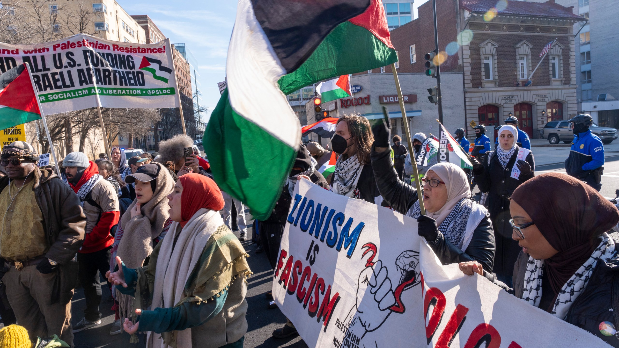 Pro-Palestinian protesters block the intersection of E St NW at New Jersey Ave. NW, near the Capitol, Thursday, Feb. 1, 2024, in Washington. (AP Photo/Jacquelyn Martin)