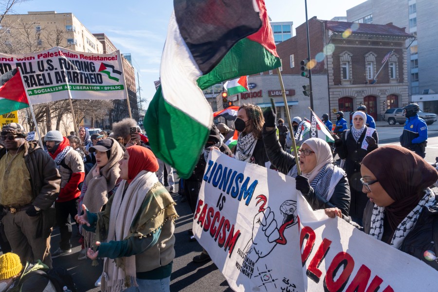 Pro-Palestinian protesters block the intersection of E St NW at New Jersey Ave. NW, near the Capitol, Thursday, Feb. 1, 2024, in Washington. (AP Photo/Jacquelyn Martin)