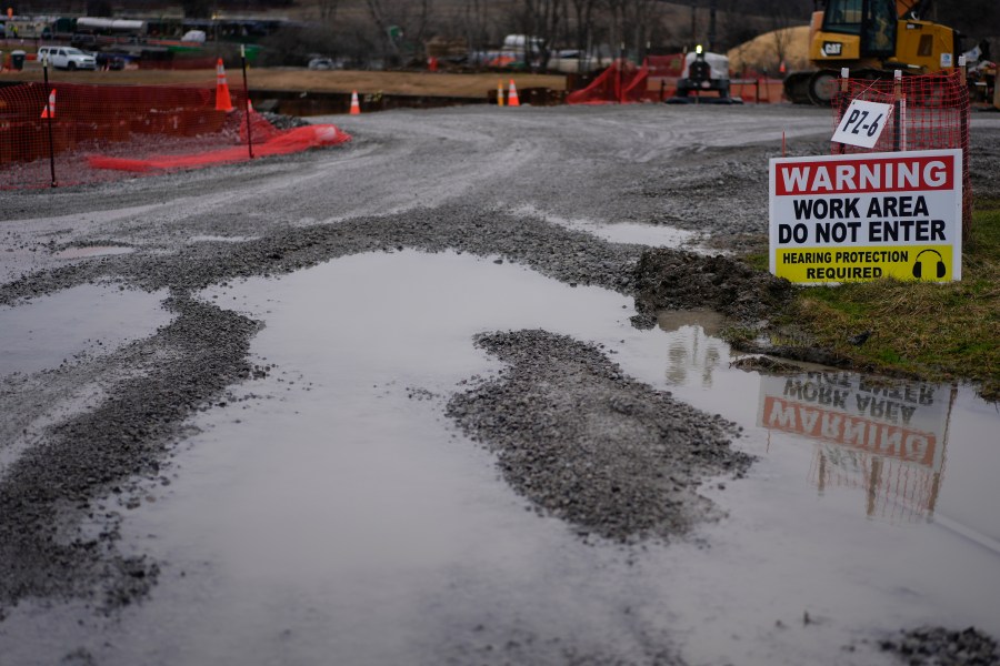 Work continues to clean and replace fill dirt at the site of the Norfolk Southern train derailment in East Palestine, Ohio, on Monday, Jan. 29, 2024. Daily life largely returned to normal for residents of East Palestine, Ohio, months after a Norfolk Southern train derailed and spilled a cocktail of hazardous chemicals that caught fire a year ago, but the worries and fears are always there. (AP Photo/Carolyn Kaster)