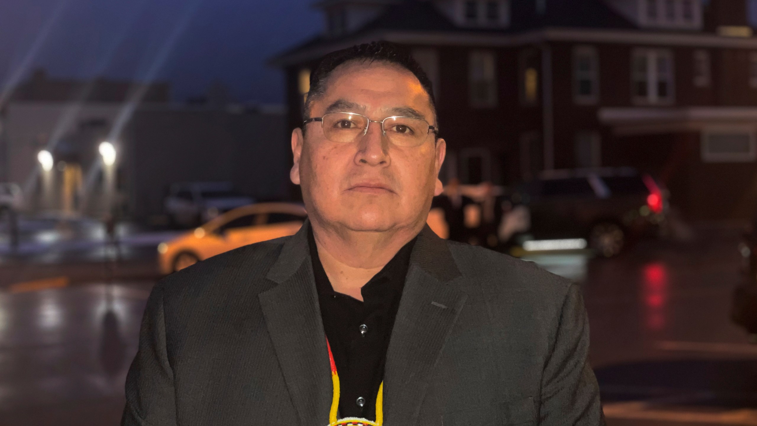 FILE - Oglala Sioux Tribe President Frank Star Comes Out stands outside the Andrew W. Bogue Federal Building and U.S. Courthouse in Rapid City, S.D., Feb. 8, 2023. The South Dakota tribe has banned Republican Gov. Kristi Noem from the Pine Ridge Reservation after she spoke this week about wanting to send razor wire and security personnel to Texas to help deter immigration at the U.S.-Mexico border and also said cartels are infiltrating the state's reservations. (Kalle Benallie/Indian Country Today via AP, File)