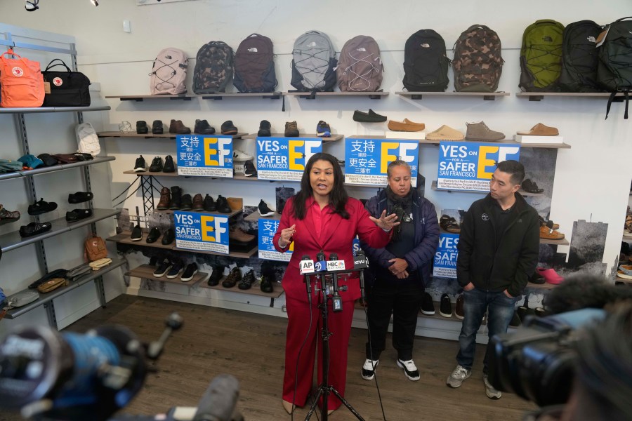 San Francisco Mayor London Breed speaks during a news conference to promote a crime measure at the Footprint retail store as store owner Mike Hsu, right, and police association President Tracy McCray listen, in San Francisco, Thursday, Jan. 25, 2024. The Democratic mayor of San Francisco is pushing a pair of controversial public safety proposals on the March 5, ballot. Critics say the measures are out of step with San Francisco's liberal politics and will hurt already marginalized communities. (AP Photo/Eric Risberg)