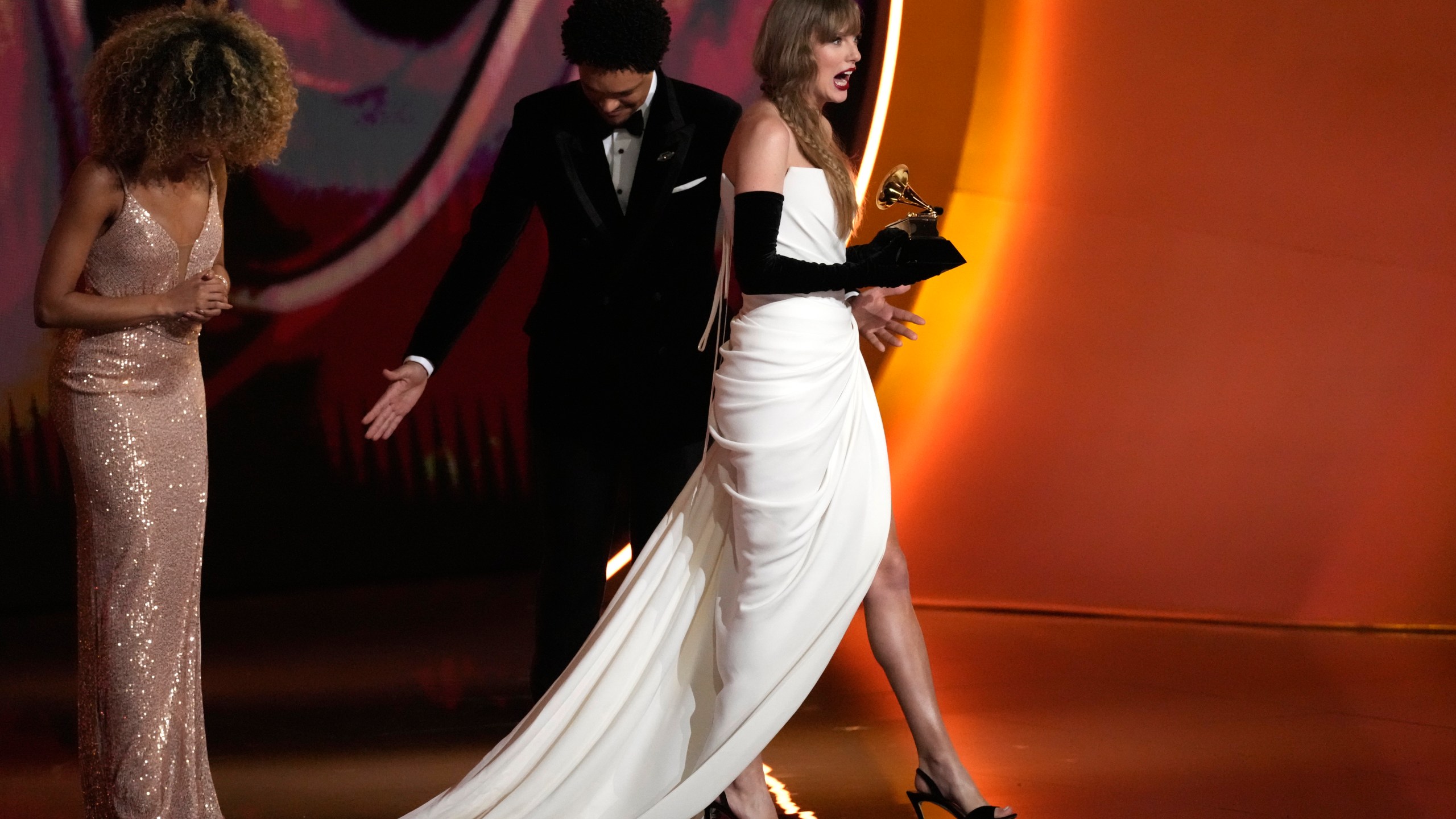 Taylor Swift accepts the award for best pop vocal album for "Midnights" during the 66th annual Grammy Awards on Sunday, Feb. 4, 2024, in Los Angeles. (AP Photo/Chris Pizzello)