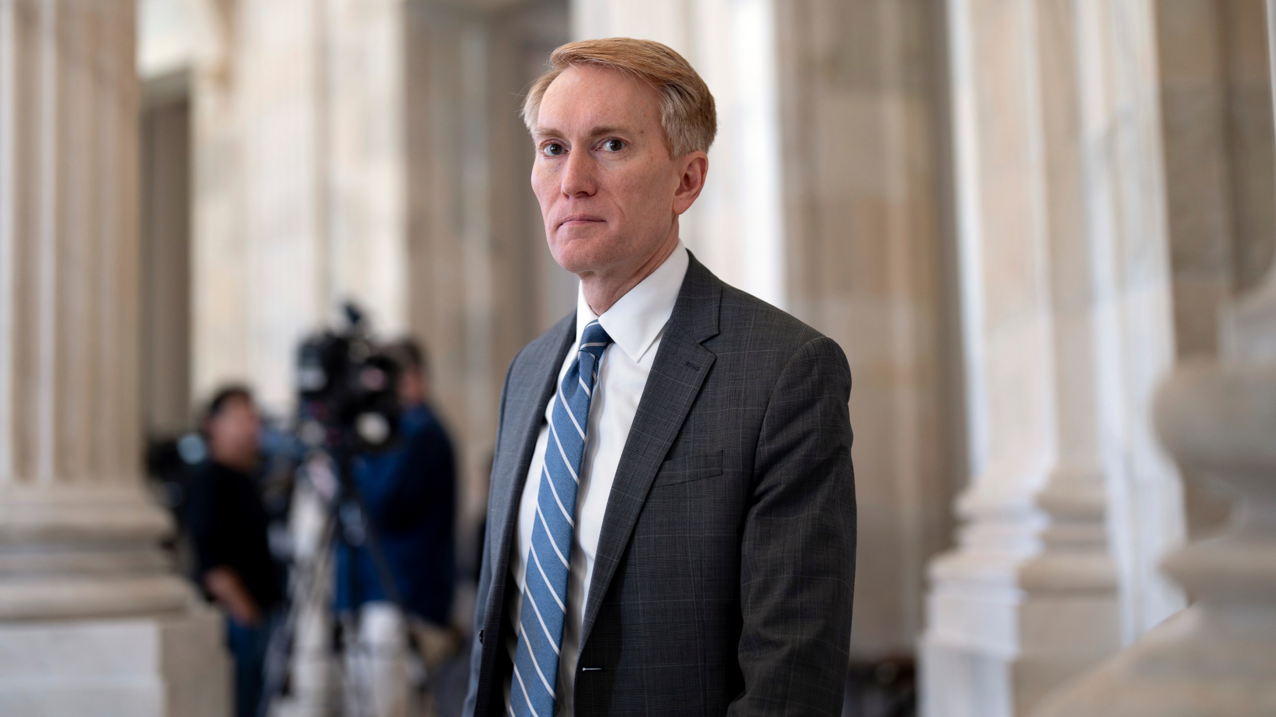 Sen. James Lankford, R-Okla., the lead GOP negotiator on the Senate border and foreign aid package, does a TV news interview at the Capitol in Washington, Monday, Feb. 5, 2024. (AP Photo/J. Scott Applewhite)