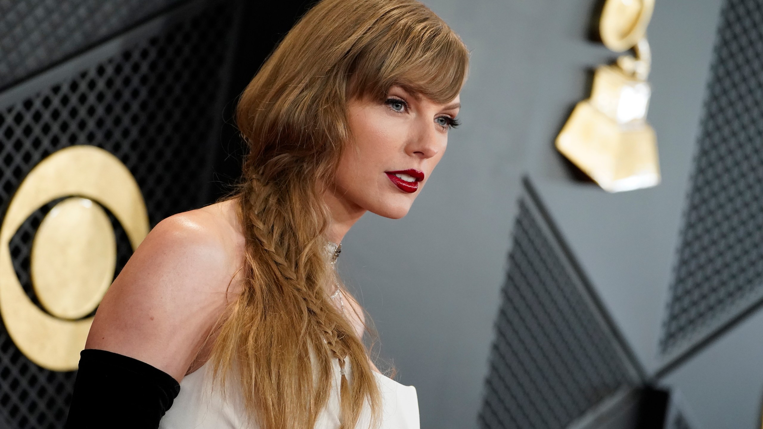 FILE - Taylor Swift arrives at the 66th annual Grammy Awards on Feb. 4, 2024, in Los Angeles. Some conservatives on cable news or on social media have speculated that Taylor Swift is part of an elaborate plot to help Democrats win the November election. However, on the campaign trail, many voters just see that talk as noise to tune out. (Photo by Jordan Strauss/Invision/AP, File)