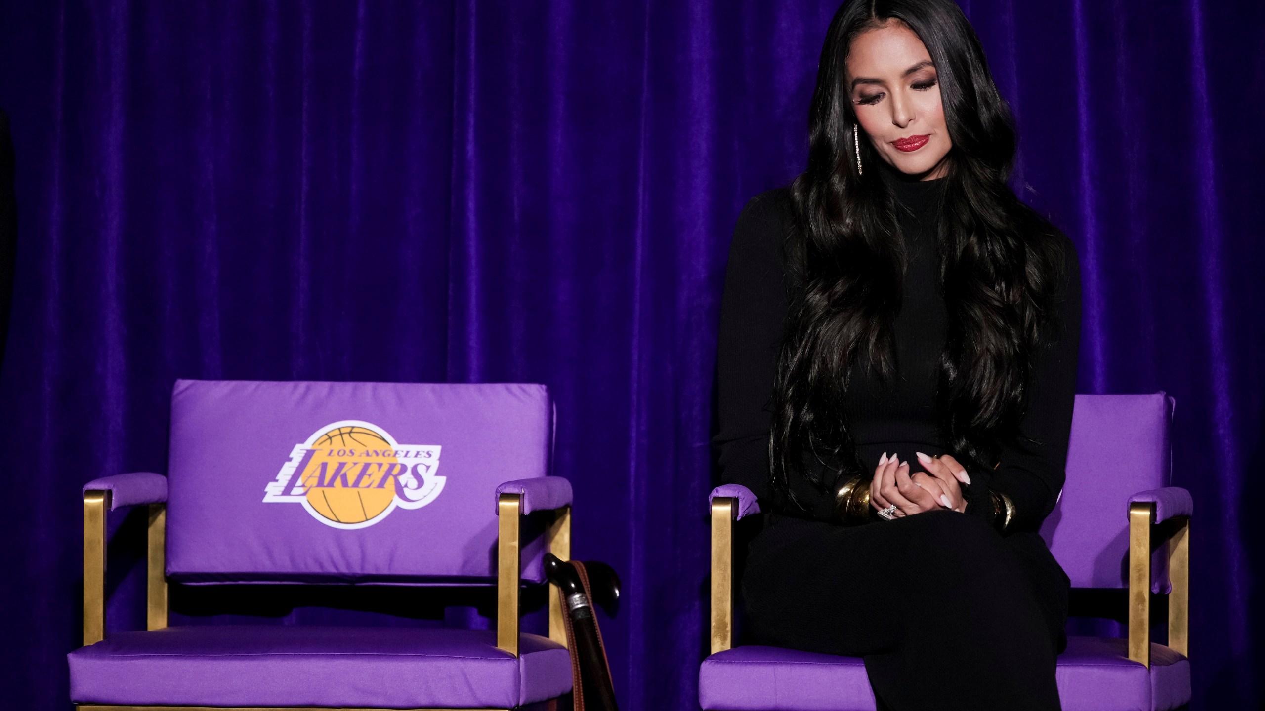 Vanessa Bryant, widow of Kobe Bryant, sits on a chair during the unveiling of a statue of Kobe Bryan outside the NBA basketball team's arena, Thursday, Feb. 8, 2024, in Los Angeles. (AP Photo/Eric Thayer)