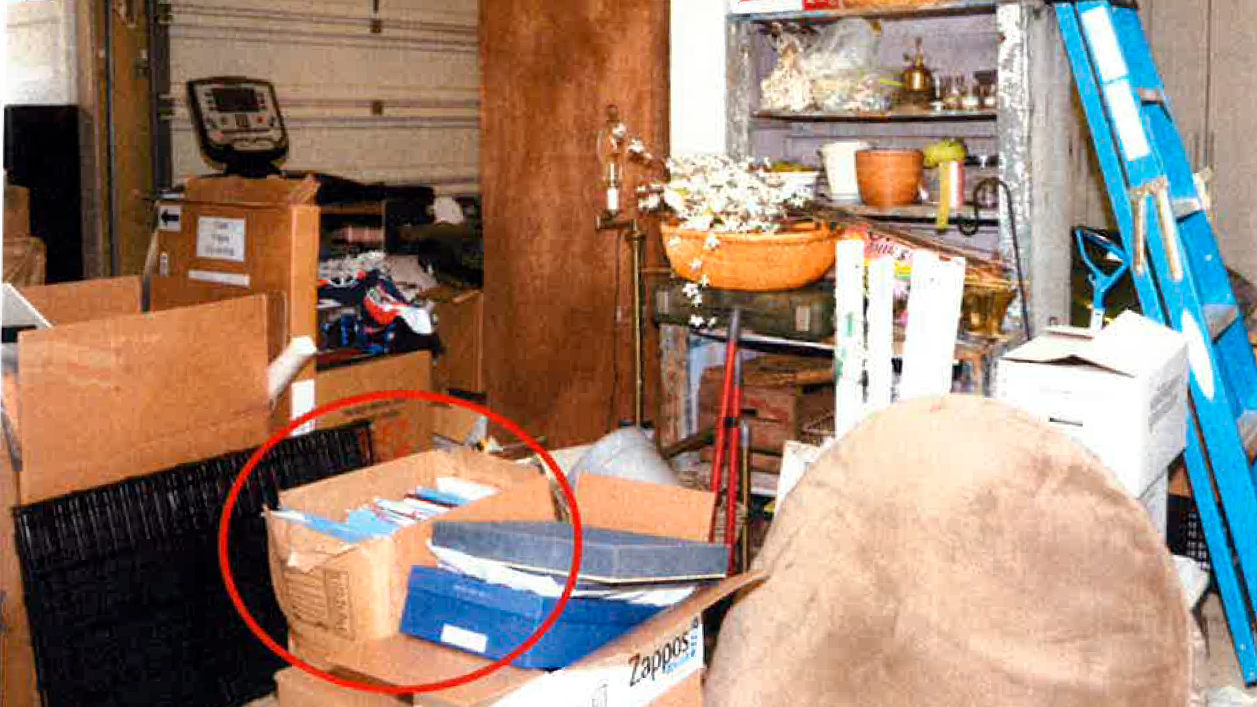 This image, contained in the report from special counsel Robert Hur, shows the box where classified Afghanistan documents were found in the garage of President Joe Biden in Wilmington, Del., during a search by the FBI on Dec. 21, 2022. (Justice Department via AP)