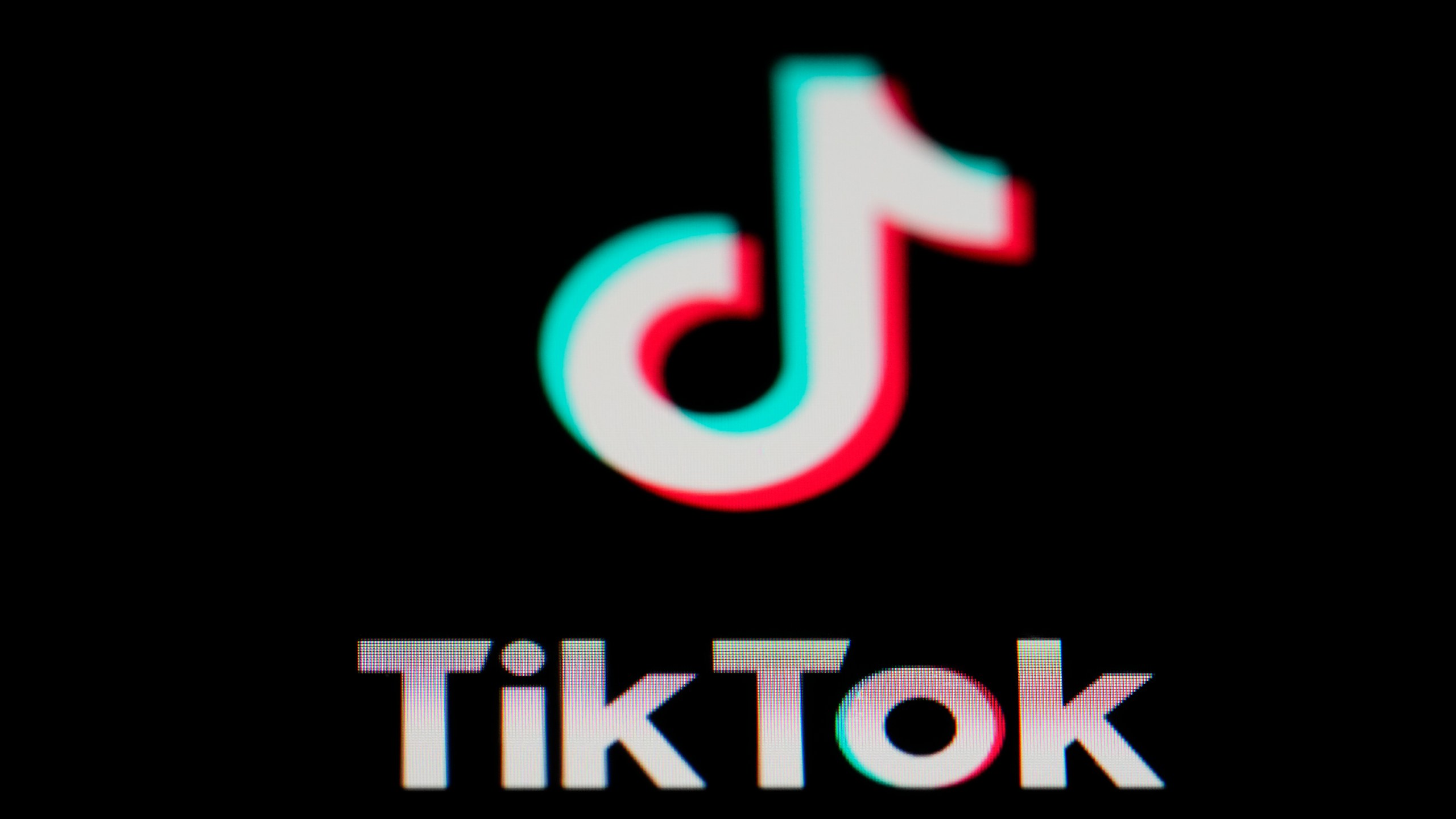 FILE - The icon for the video sharing TikTok app is seen on a smartphone, Tuesday, Feb. 28, 2023, in Marple Township, Pa. A former TikTok executive is alleging she was retaliated against and fired from her position because the company’s China-based owners determined she “lacked the docility and meekness” required of female employees, Friday, Feb. 9, 2024. (AP Photo/Matt Slocum, File)