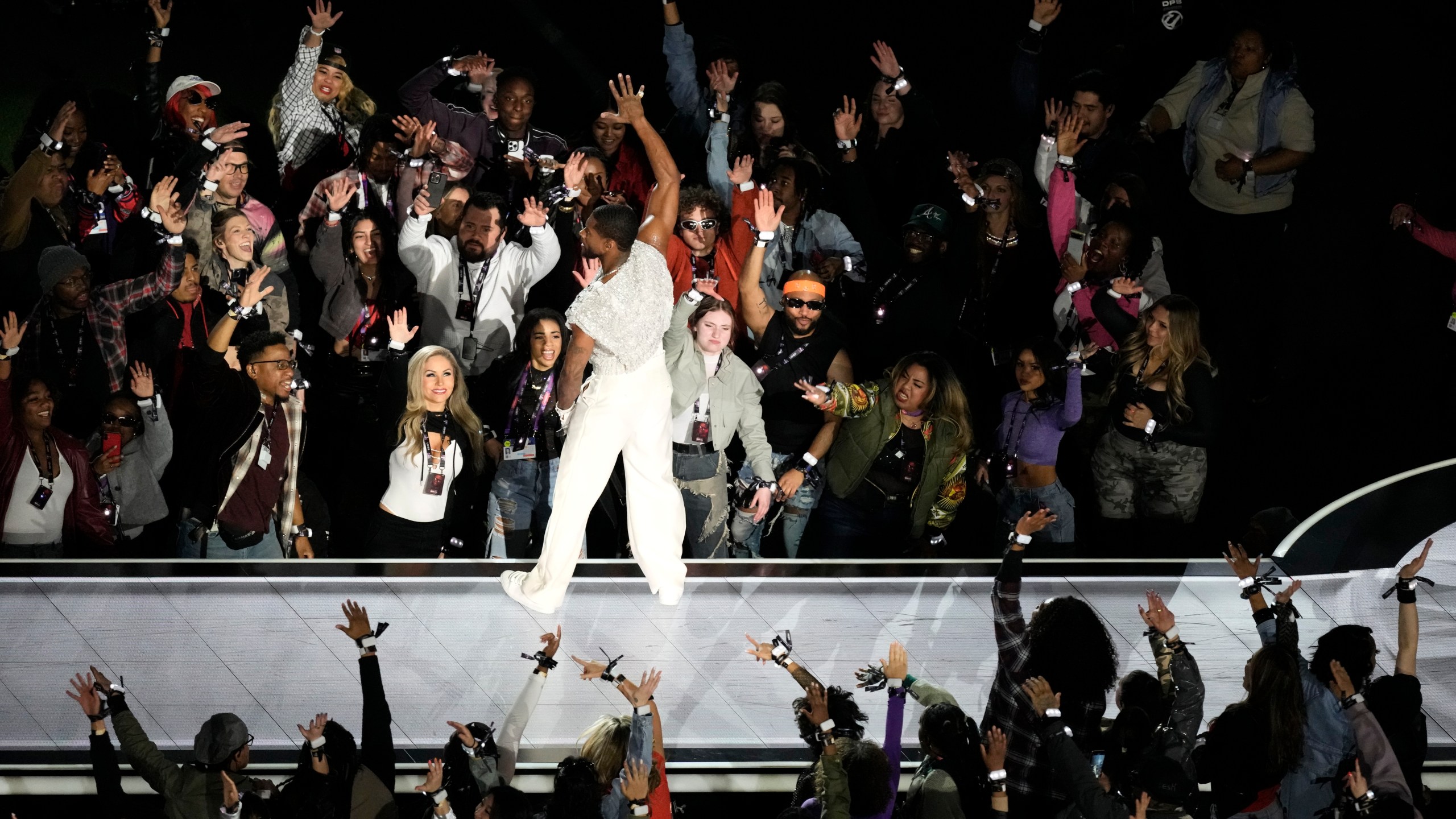 Usher performs during halftime of the NFL Super Bowl 58 football game between the San Francisco 49ers and the Kansas City Chiefs on Sunday, Feb. 11, 2024, in Las Vegas. (AP Photo/Charlie Riedel)