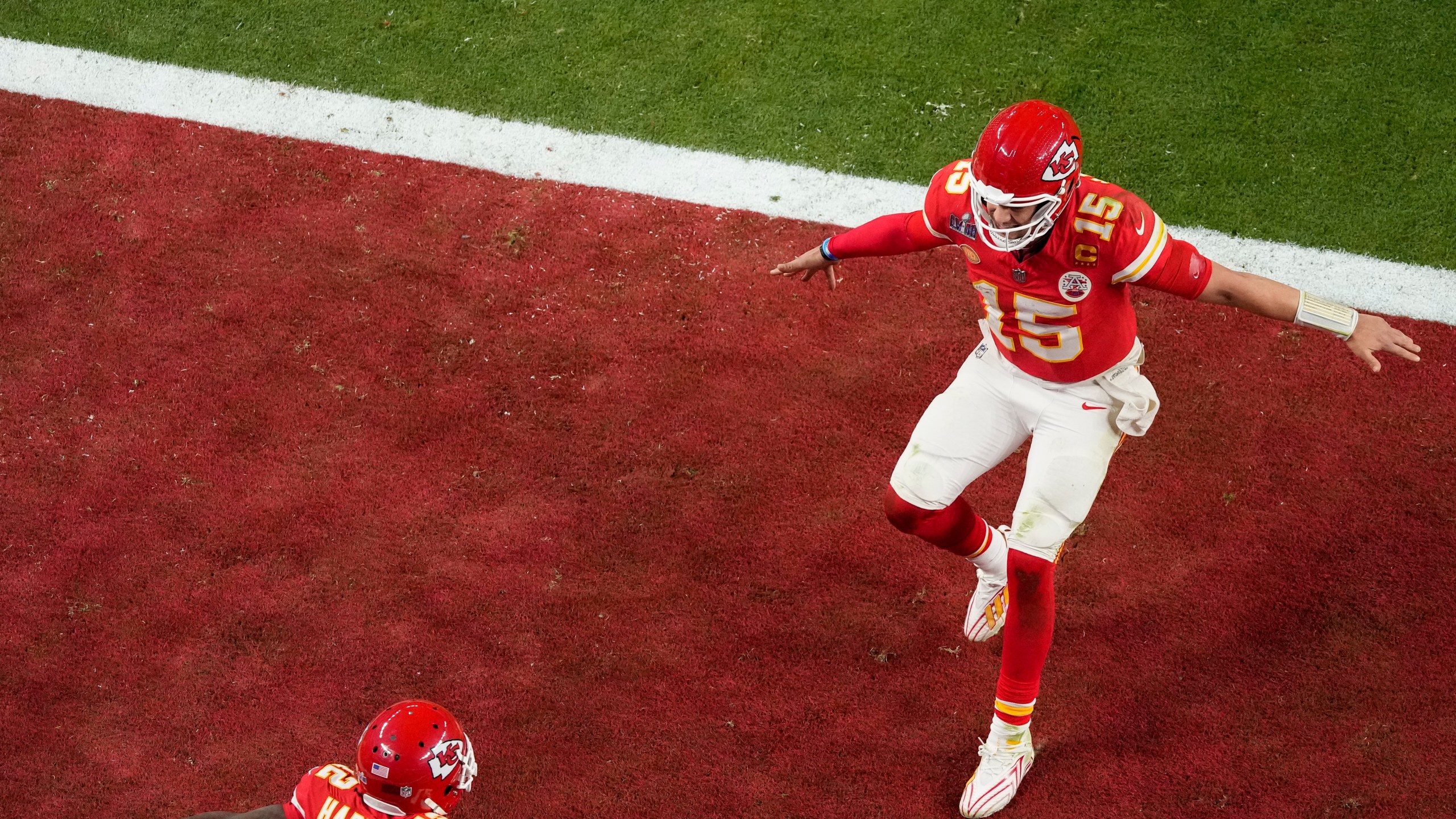 Kansas City Chiefs quarterback Patrick Mahomes, right, celebrates with wide receiver Mecole Hardman Jr. after throwing the game-winning touchdown against the San Francisco 49ers during overtime of the NFL Super Bowl 58 football game Sunday, Feb. 11, 2024, in Las Vegas. (AP Photo/David J. Phillip)