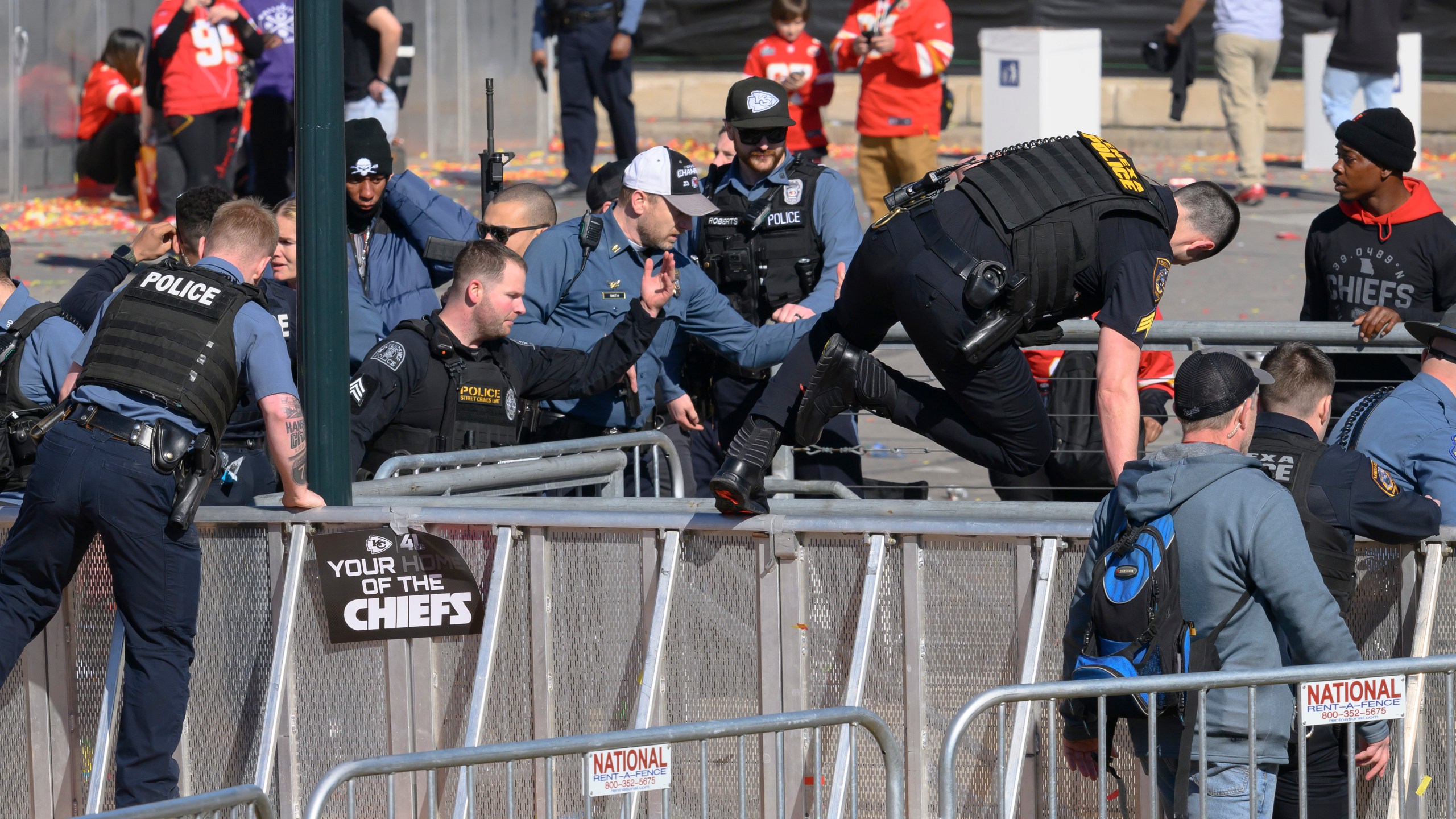 Law enforcement personnel clear the area around Union Station following a shooting at the Kansas City Chiefs NFL football Super Bowl celebration in Kansas City, Mo., Wednesday, Feb. 14, 2024. Multiple people were injured, a fire official said.. (AP Photo/Reed Hoffmann)