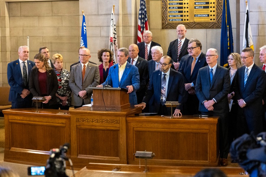 Gov. Jim Pillen is joined by republican state senators as he announces that the state will participate in the Summer Electronic Benefits Transfer Program after previously saying Nebraska wouldn't take part during a press conference in the Warner Chamber at the Capitol, Monday, Feb. 12, 2024, in Lincoln, Neb. (Kenneth Ferriera/Lincoln Journal Star via AP)