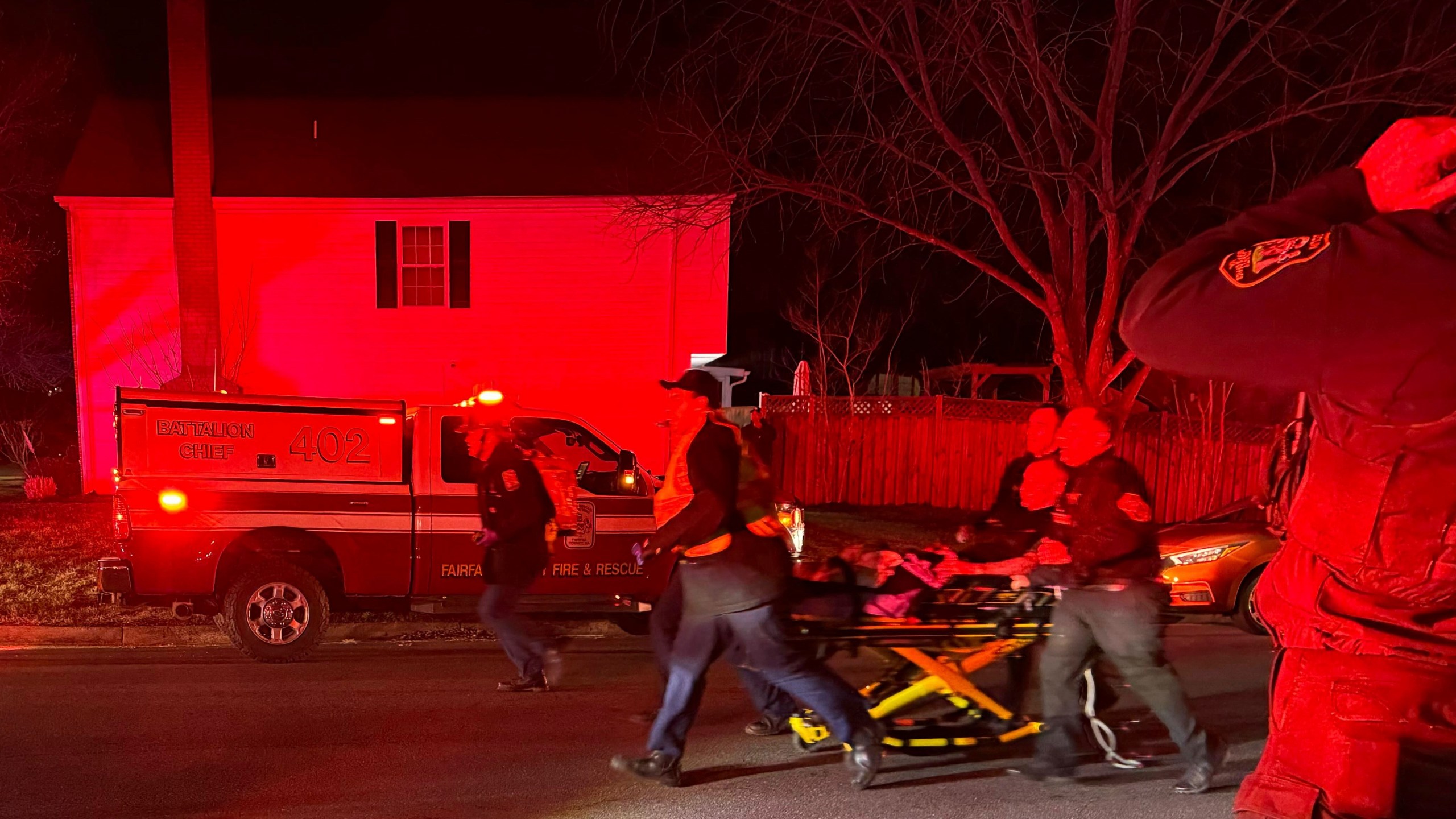 First responders carry an injured person away after an explosion at a home, late Friday, Feb. 16, 2024, in Sterling, Va. (Nicki Jhabvala/The Washington Post via AP)