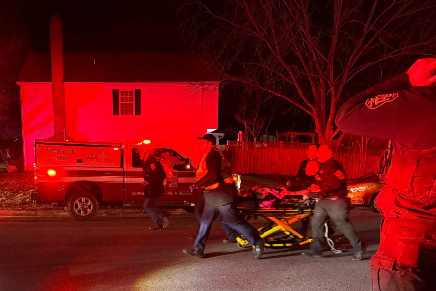 First responders carry an injured person away after an explosion at a home, late Friday, Feb. 16, 2024, in Sterling, Va. (Nicki Jhabvala/The Washington Post via AP)