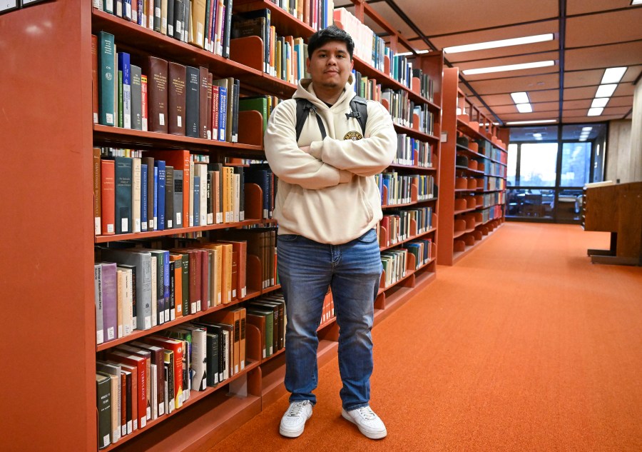 Jesus Noyola, a sophomore attending Rensselaer Polytechnic Institute, poses for a portrait in the Folsom Library, Tuesday, Feb. 13, 2024, in Troy, N.Y. A later-than-expected rollout of a revised Free Application for Federal Student Aid, or FASFA, that schools use to compute financial aid, is resulting in students and their parents putting off college decisions. Noyola said he hasn’t been able to submit his FAFSA because of an error in the parent portion of the application. “It’s disappointing and so stressful since all these issues are taking forever to be resolved,” said Noyola, who receives grants and work-study to fund his education. (AP Photo/Hans Pennink)