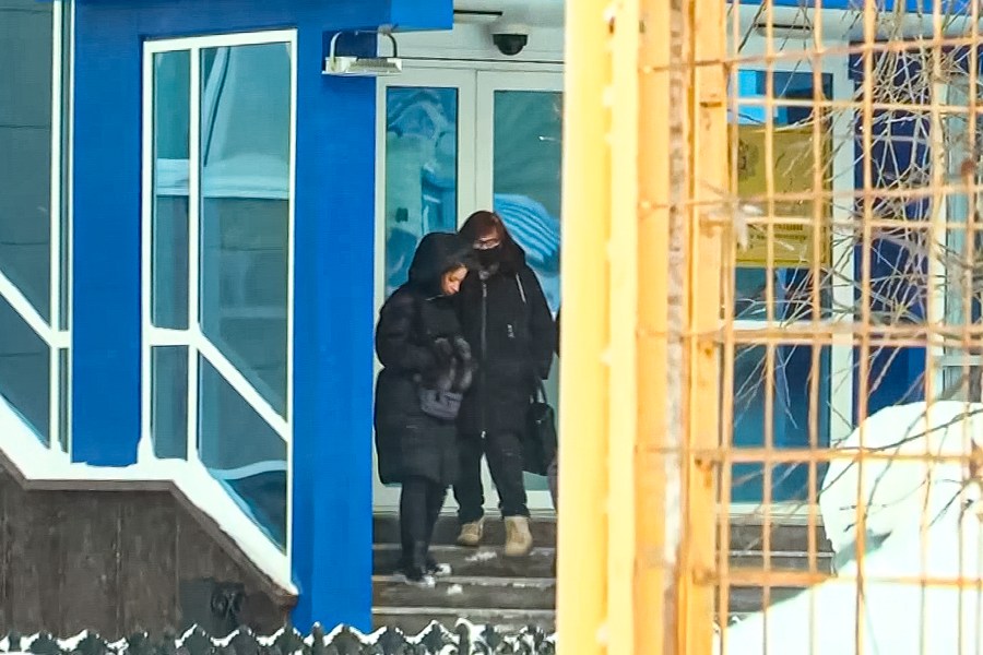 In this grab taken from video, Lyudmila Navalnaya, mother of Russian opposition leader Alexei Navalny, right, leaves the building of the Investigative Committee, regional department in Yamal-Nenets region in Salekhard, 1937 km (1211 miles) northeast of Moscow, Russia, Monday, Feb. 19, 2024. Russians across the vast country streamed to ad-hoc memorials with flowers and candles to pay tribute to Alexei Navalny, the most famous Russian opposition leader and the Kremlin's fiercest critic. Russian officials reported that Navalny, 47, died in prison on Friday. (AP Photo)