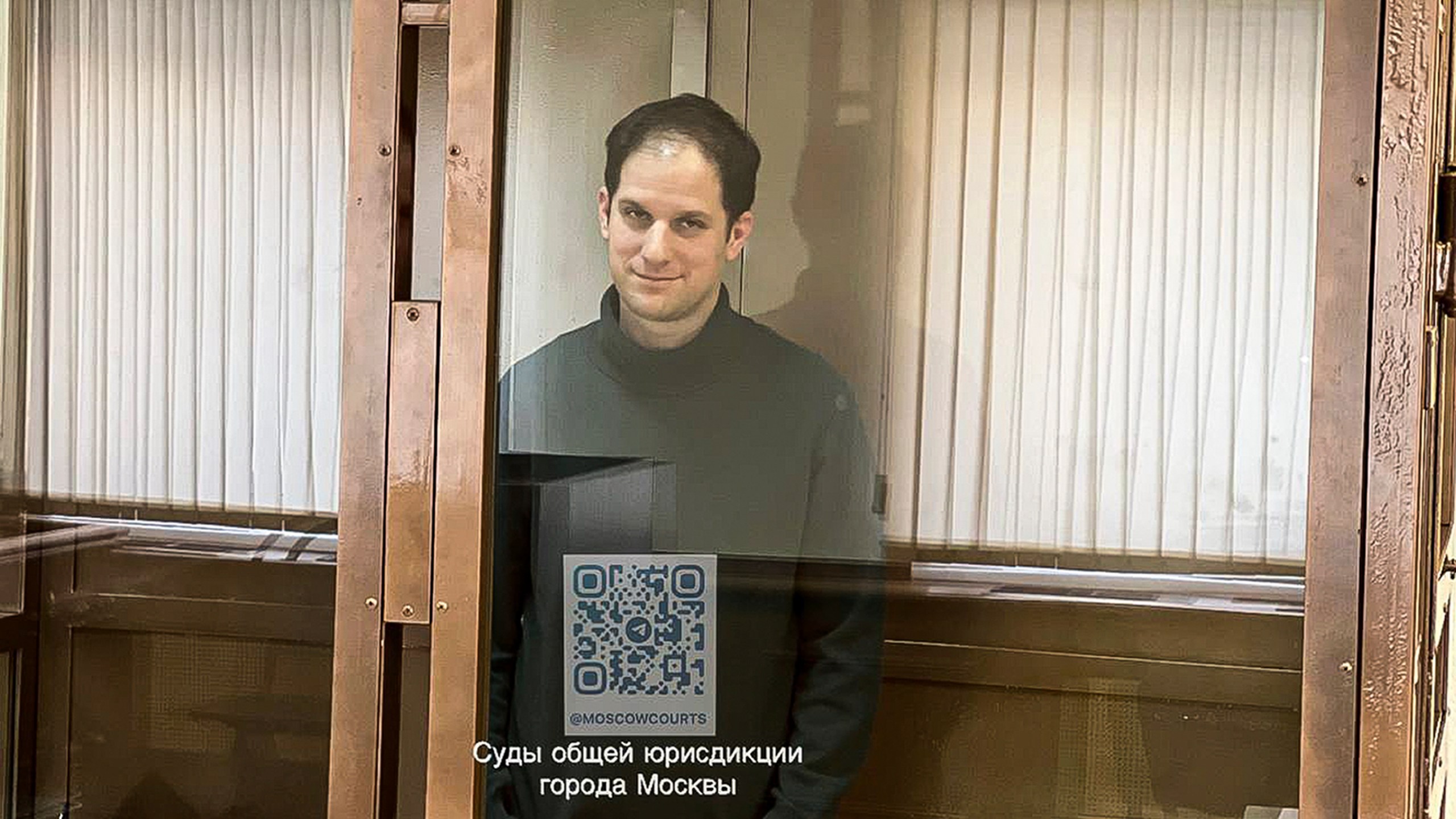 In this photo released by the Moscow's City Court, Wall Street Journal reporter Evan Gershkovich stands in a glass cage in a courtroom at the Moscow City Court, in Moscow, Russia, on Tuesday, Feb. 20, 2024. (Moscow City Court via AP)