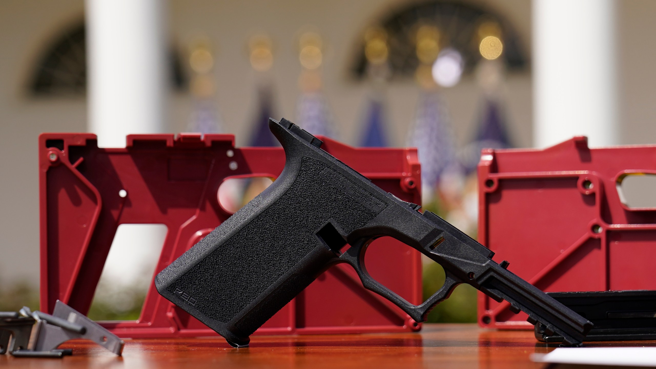 FILE - A 9mm "ghost gun" pistol build kit with a commercial slide and barrel with a polymer frame is displayed in the Rose Garden of the White House in Washington, Monday, April 11, 2022. A leading manufacturer of ghost guns has agreed Wednesday, Feb. 21, 2024, to stop selling its untraceable, unassembled firearms to Maryland residents. (AP Photo/Carolyn Kaster, File)