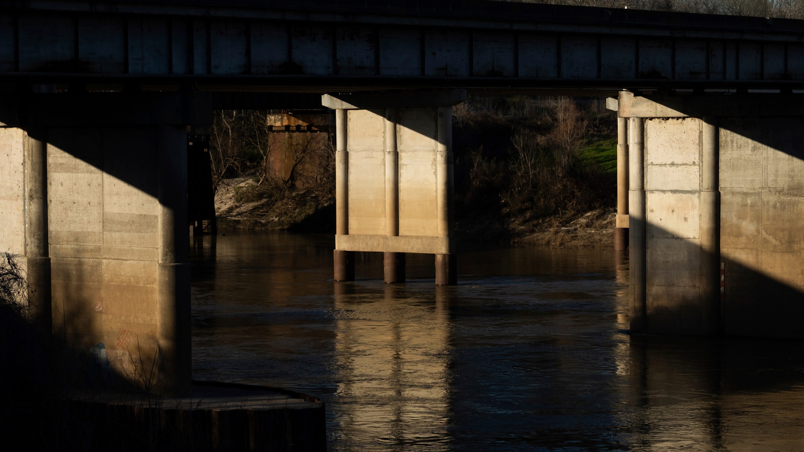 The Trinity River is seen near where law enforcement found the body of 11-year-old Audrii Cunningham, Tuesday, Feb. 20, 2024, in Livingston, Texas. Divers have recovered the body Cunningham days after the girl went missing, and authorities are preparing to file a murder charge against a friend of her father who lived on her family’s property, a sheriff said Tuesday afternoon. (Jason Fochtman/Houston Chronicle via AP)