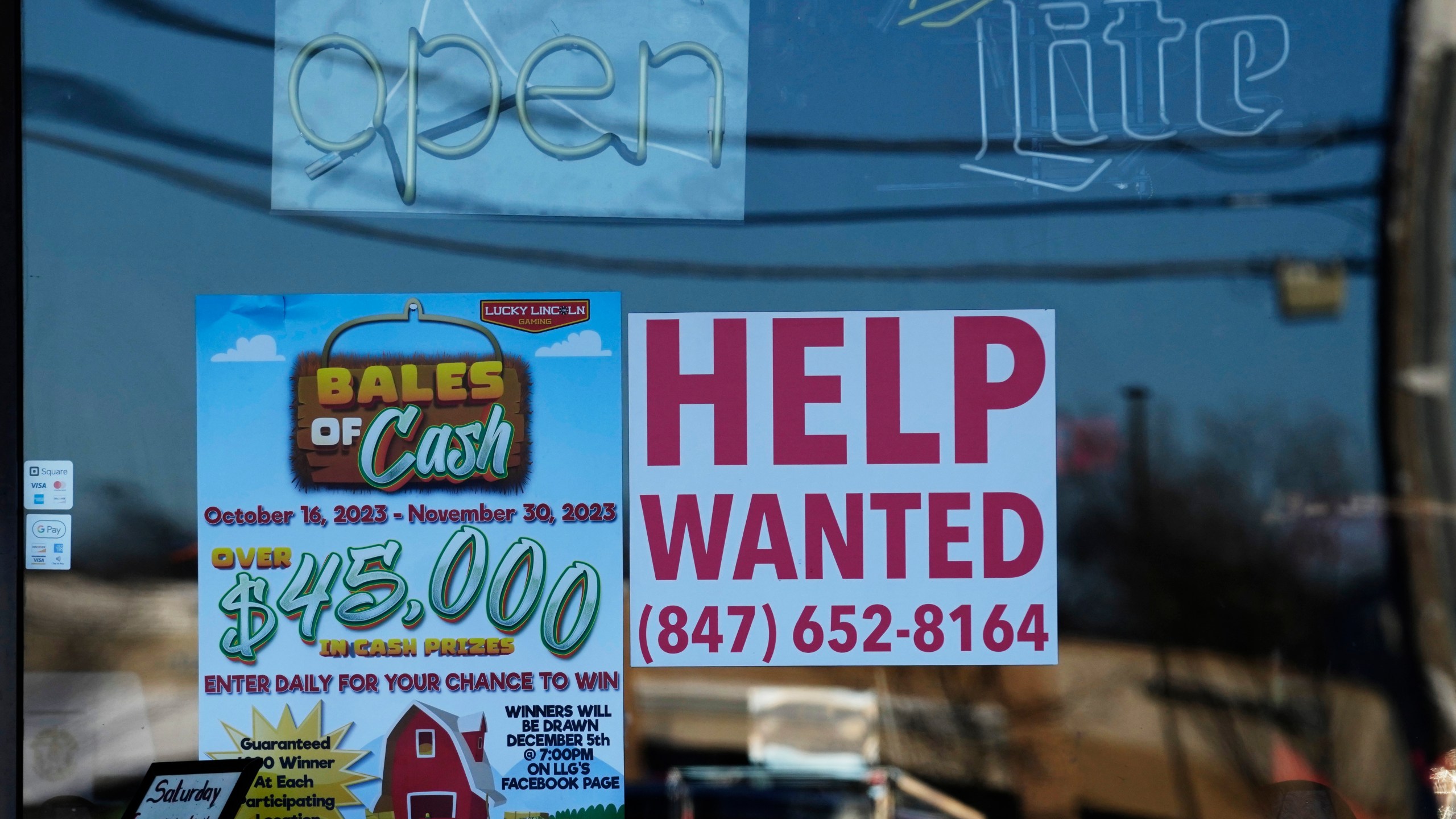 A "Help Wanted" sign is displayed at a restaurant in Buffalo Grove, Ill., Thursday, Jan. 18, 2024. On Thursday, Feb. 22, 2024, the Labor Department reports on the number of people who applied for unemployment benefits last week. (AP Photo/Nam Y. Huh)