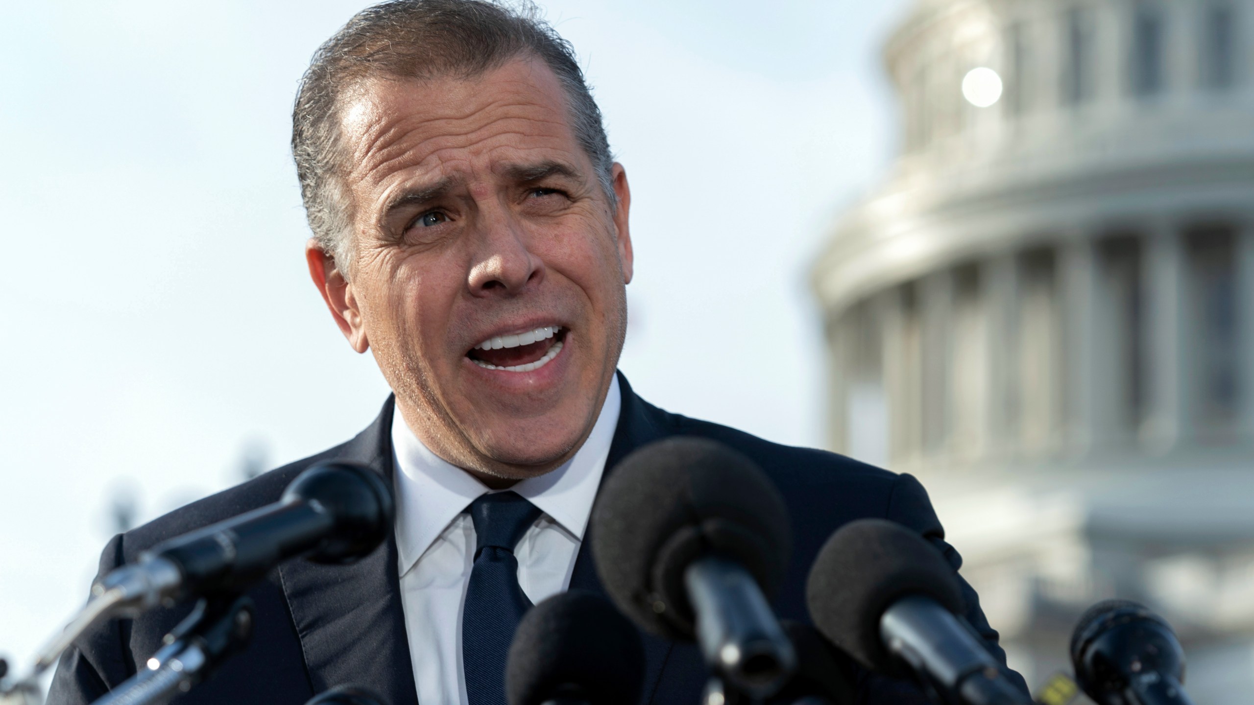 FILE - Hunter Biden, son of President Joe Biden, talks to reporters at the U.S. Capitol, in Washington, Dec. 13, 2023. An FBI informant has been charged with lying to his handler about ties between Joe Biden and son Hunter and a Ukrainian energy company. Prosecutors said Thursday that Alexander Smirnov falsely told FBI agents in June 2020 that executives associated with the Ukrainian energy company Burisma paid Hunter and Joe Biden $5 million each in 2015 and 2016.(AP Photo/Jose Luis Magana. File)