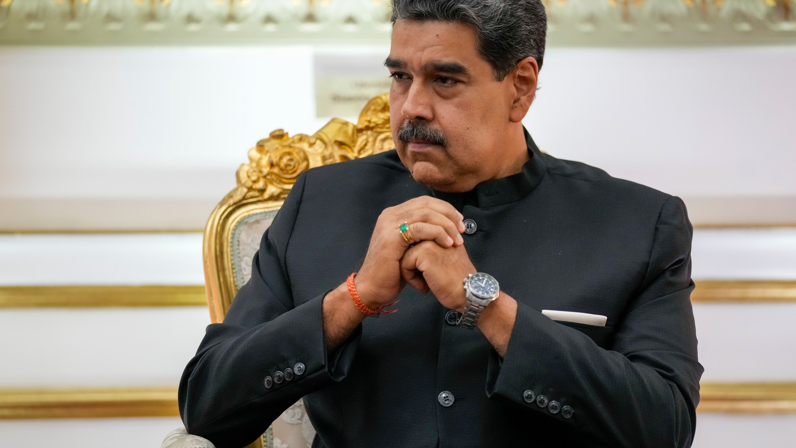 FILE - Venezuelan President Nicolás Maduro listens during their meeting at Miraflores presidential palace in Caracas, Venezuela, Feb. 20, 2024. On Thursday, Feb. 22, Joshua Holt, a Utah man imprisoned for nearly two years in Venezuela, sued Maduro, accusing the leftist leader of heading a “criminal enterprise” that kidnaps, tortures and unjustly imprisons American citizens. (AP Photo/Ariana Cubillos, File)