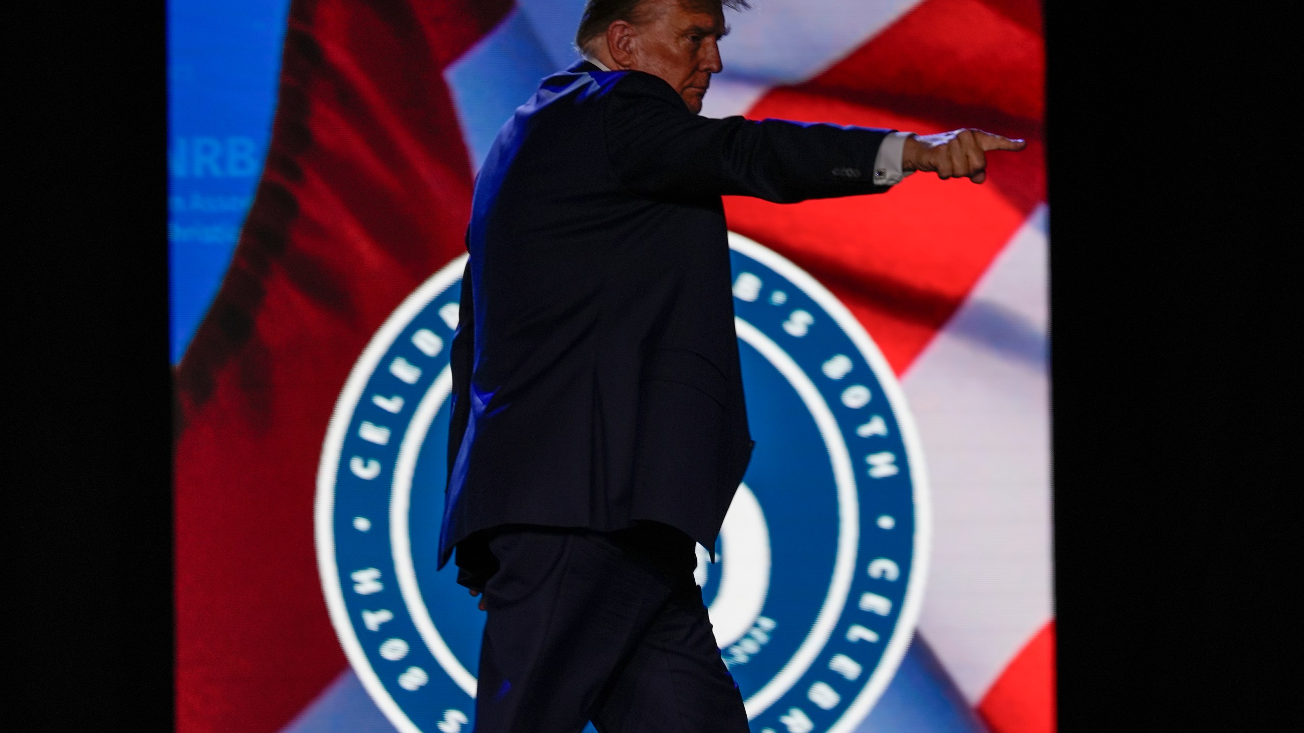 Republican presidential candidate former President Donald Trump gestures at the National Religious Broadcasters convention at the Gaylord Opryland Resort and Convention Center Thursday, Feb. 22, 2024, in Nashville, Tenn. (AP Photo/George Walker IV)