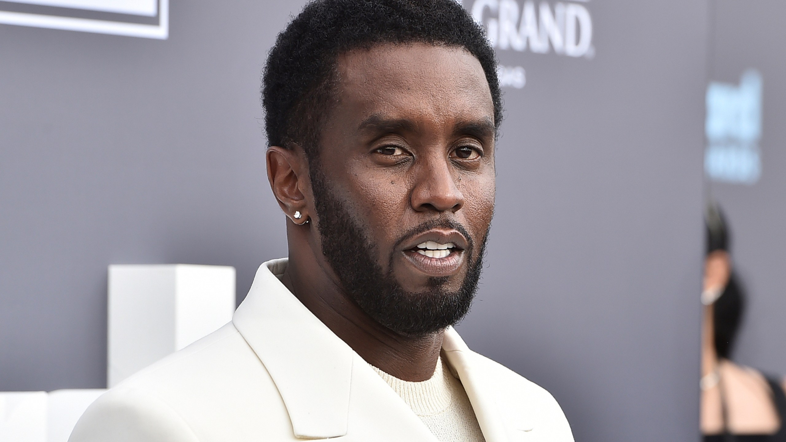 FILE - Music mogul and entrepreneur Sean "Diddy" Combs arrives at the Billboard Music Awards, May 15, 2022, in Las Vegas. Combs was sued Monday, Feb. 26, 2024, by a music producer who accused the hip-hop mogul of sexually assaulting him and forcing him to have sex with prostitutes. (Photo by Jordan Strauss/Invision/AP, File)