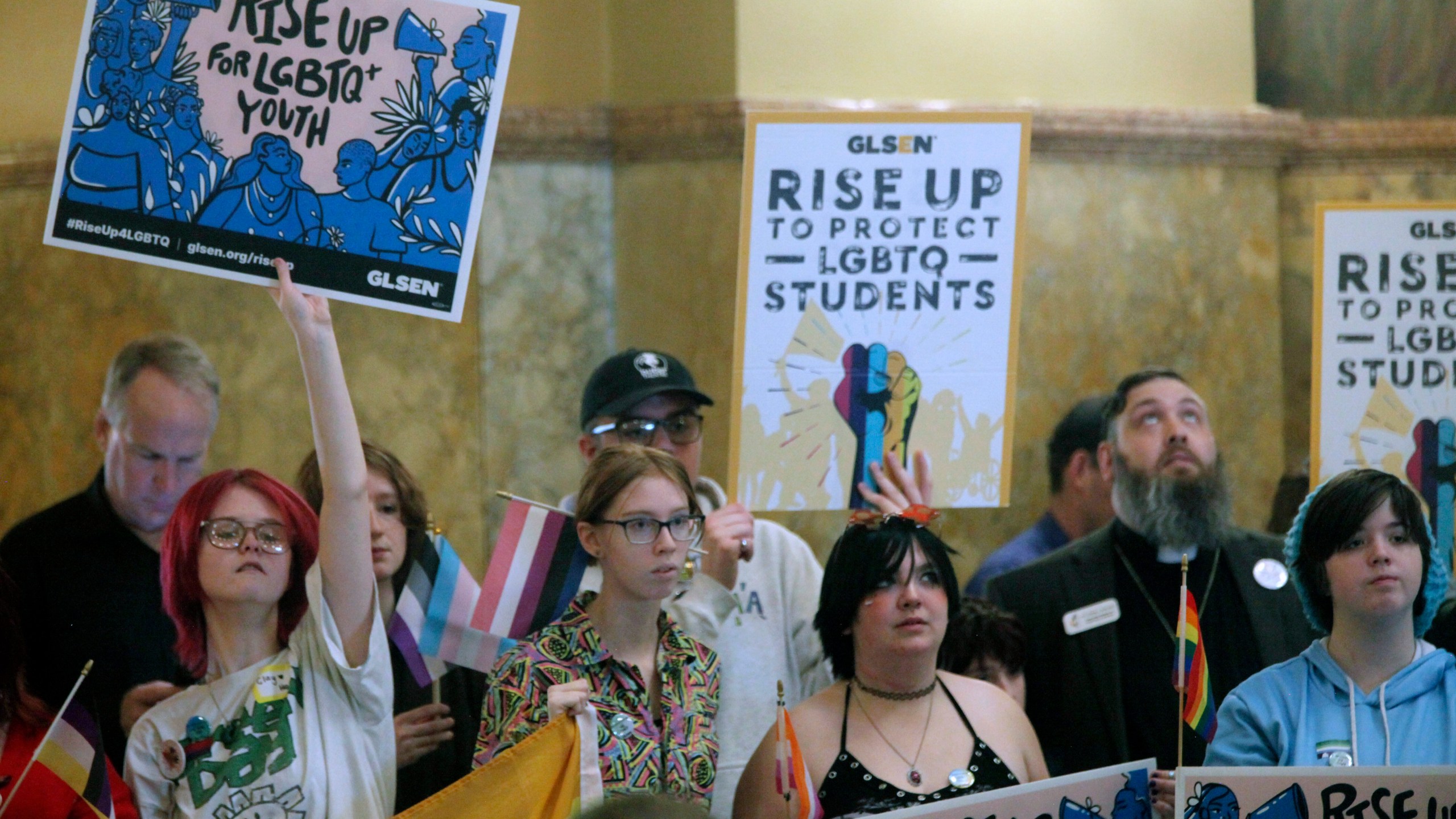 FILE - Kansas high school students, family members and advocates rally for transgender rights, Wednesday, Jan. 31, 2024, at the Statehouse in Topeka, Kan. Kansas enacted a law last year that ended legal recognition of transgender identities. The measure says there are only two sexes, male and female, that are based on a person’s “biological reproductive system" at birth. (AP Photo/John Hanna, File)