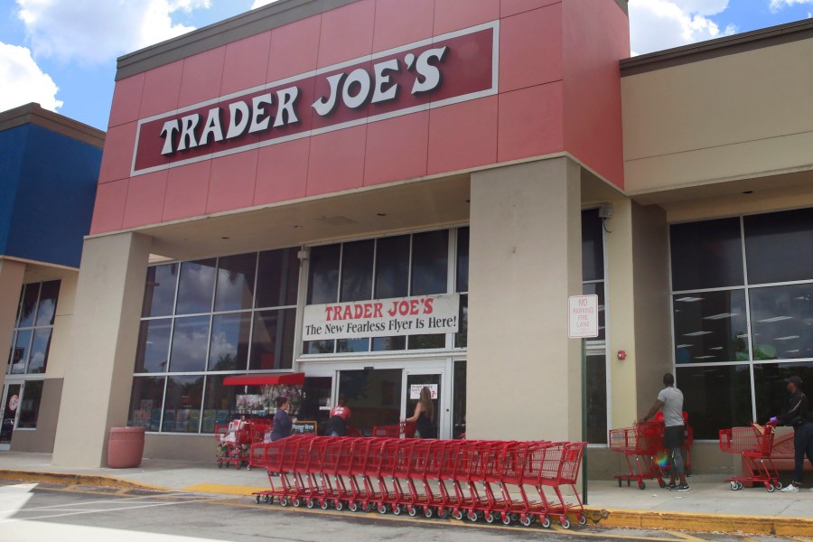 FILE - People stand in line waiting to enter Trader Joe's to buy groceries in Pembroke Pines, Fla., on March 24, 2020. More than 61,000 pounds of steamed chicken soup dumplings sold at Trader Joe's are being recalled for possibly containing hard plastic, U.S. regulators announced Saturday, March 2, 2024. (AP Photo/Brynn Anderson, File)