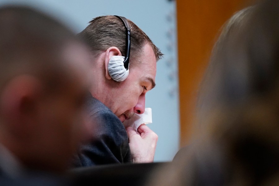 James Crumbley becomes emotional during the testimony of Oxford High School educator Molly Darnell as he sits with his attorney Mariell Lehman on Thursday, March. 7, 2024 in Pontiac, Mich. James Crumbley, 47, is charged with four counts of involuntary manslaughter, one for each teenager killed by Ethan Crumbley at Oxford High School in 2021. (Mandi Wright/Detroit Free Press via AP, Pool)