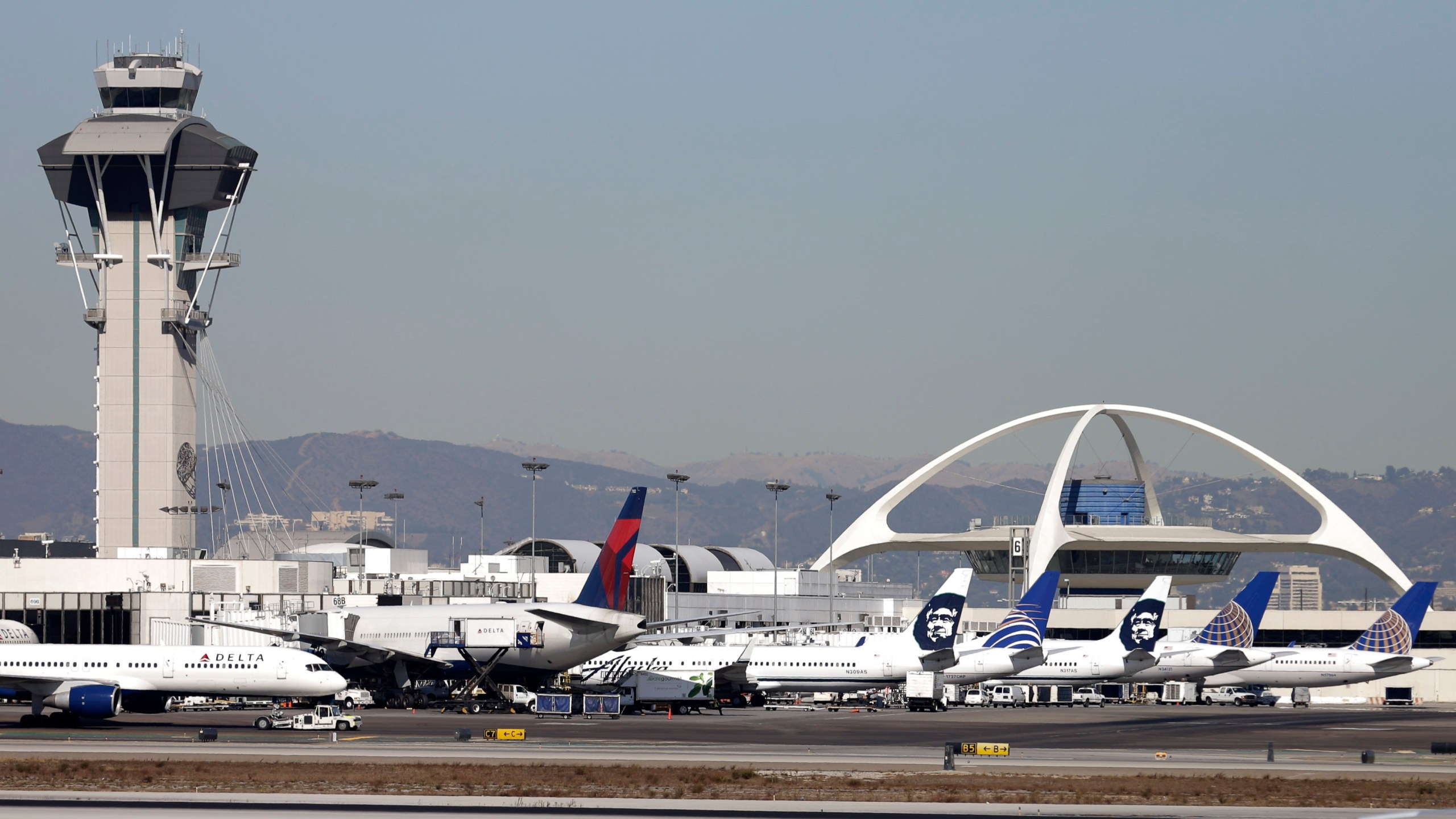 FILE - Airplanes sit on the tarmac at Los Angeles International Airport Friday, Nov. 1, 2013. A United Airlines jetliner headed to Mexico City from San Francisco made an emergency landing in Los Angeles on Friday, March 8, 2024 after the crew reported a hydraulics issue, in the fourth emergency involving a United Airlines flight this week. (AP Photo/Gregory Bull, File)