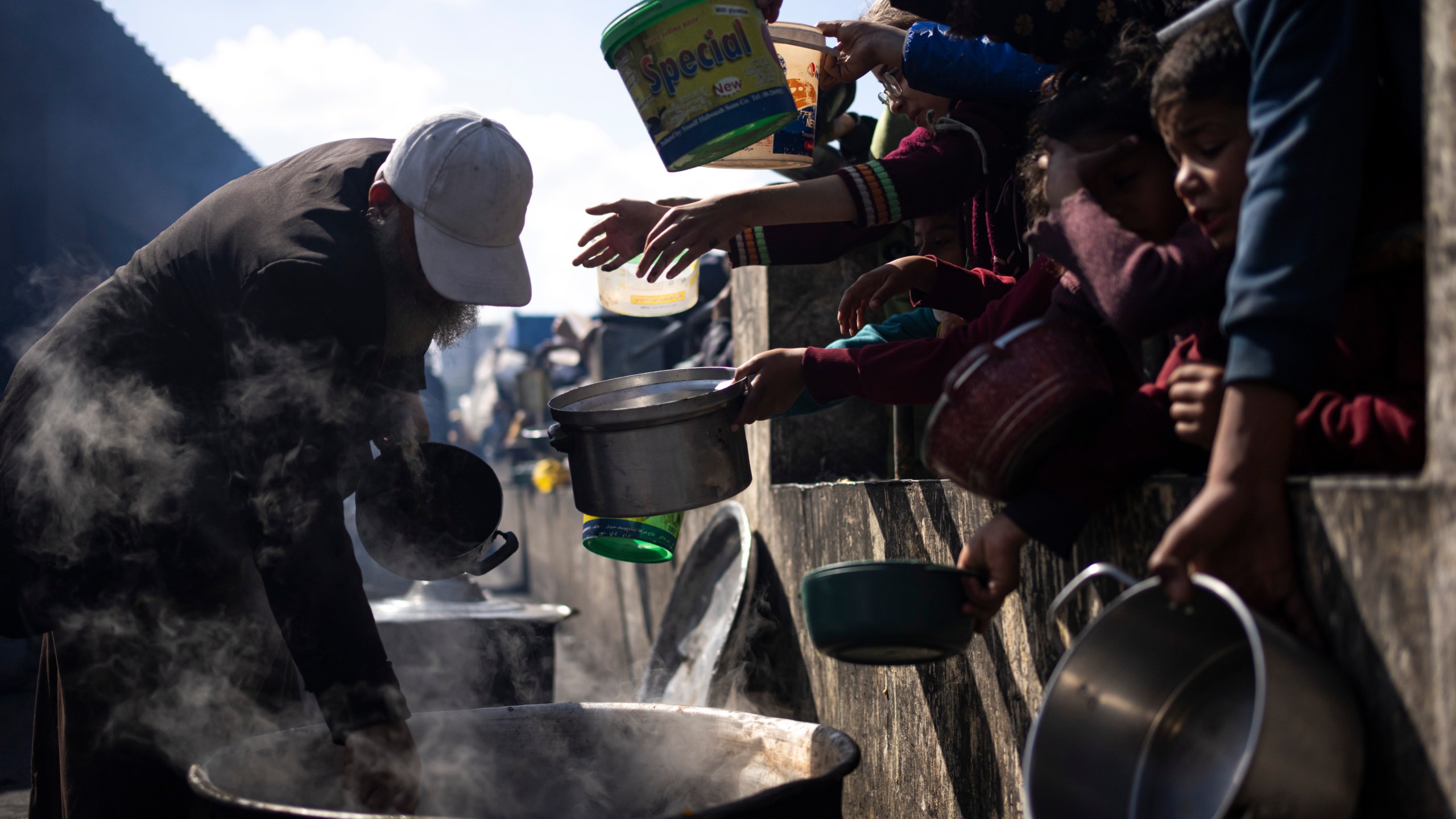 FILE - Palestinians line up for a free meal in Rafah, Gaza Strip, Friday, Feb. 16, 2024. President Joe Biden has proposed the delivery of humanitarian assistance to Gaza via a temporary port on the territory’s Mediterranean coast. (AP Photo/Fatima Shbair, File)