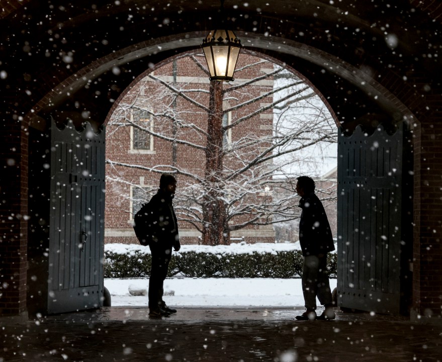 FILE - Wheaton College students stop to chat on the Norton, Mass. campus, Feb. 13, 2024 as snow falls. More than 75 million student loan borrowers have enrolled in the U.S. government's newest repayment plan since it launched in August. (Mark Stockwell/The Sun Chronicle via AP, File)