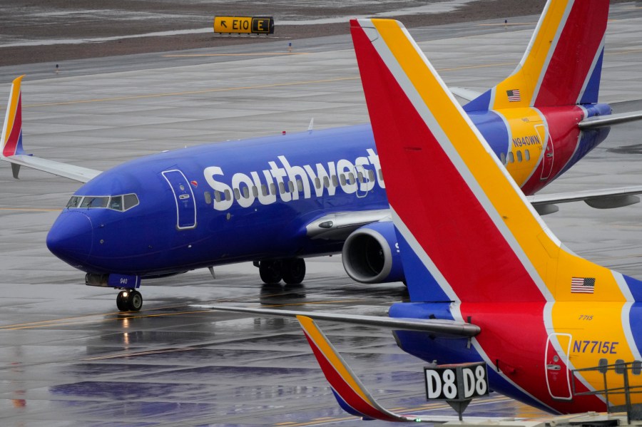 FILE - A Southwest Airlines jet arrives at Sky Harbor International Airport in Phoenix on Dec. 28, 2022. Shares of Southwest are falling in Tuesday, March 12, 2024, premarket trading as the airline said that it plans to reduce capacity and reevaluate its full-year financial outlook because of fewer expected aircraft deliveries from it supplier, Boeing. (AP Photo/Matt York, File)