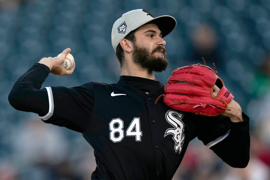 Chicago White Sox starting pitcher Dylan Cease throws in the first inning of a spring training baseball game against the Cincinnati Reds on Tuesday, March 12, 2024, in Goodyear, Ariz. (AP Photo/Carolyn Kaster)