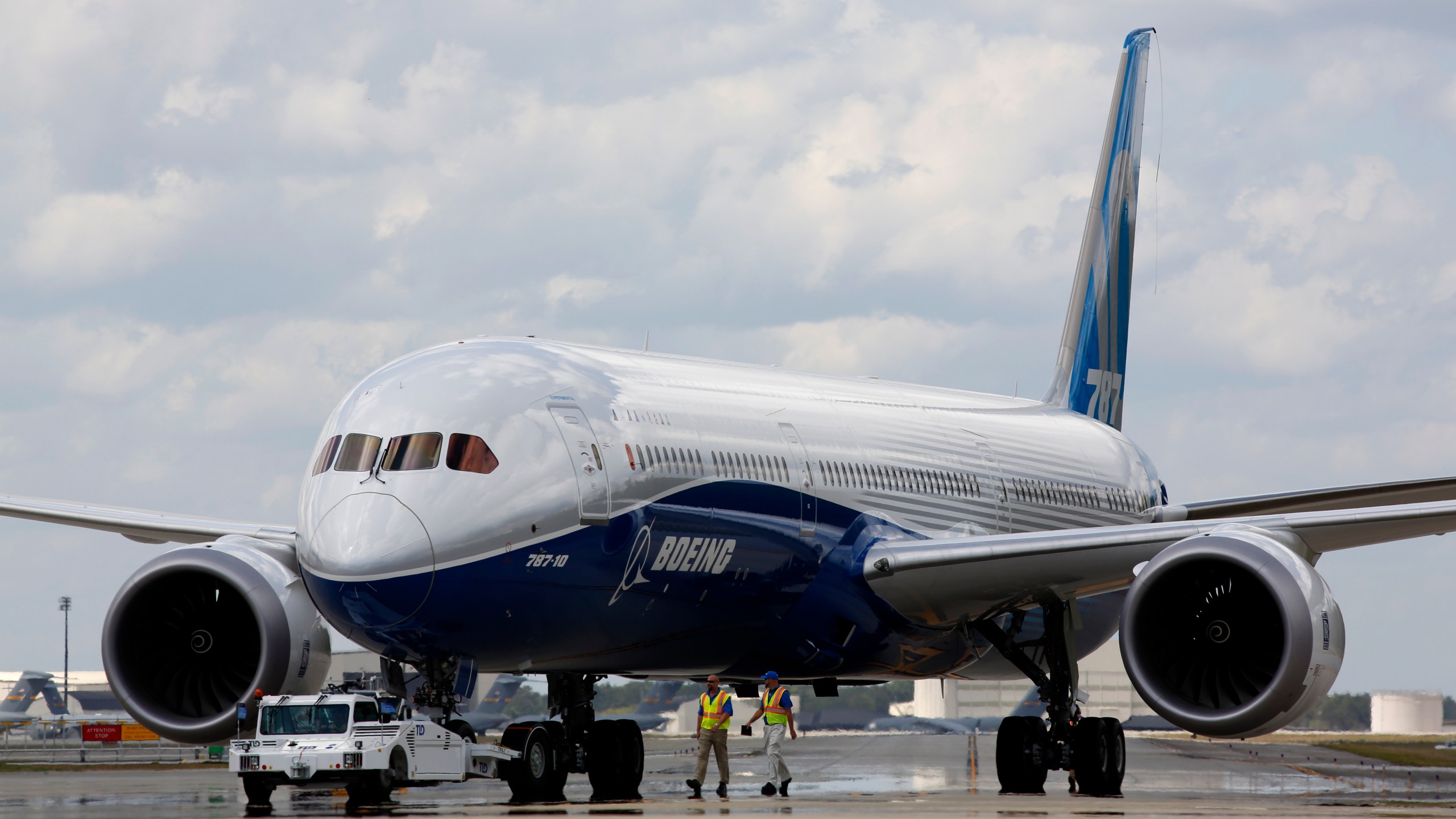 FILE - In this Friday, March 31, 2017, file photo, Boeing employees walk the new Boeing 787-10 Dreamliner down towards the delivery ramp area at the company's facility in South Carolina after conducting its first test flight at Charleston International Airport in North Charleston, S.C. Boeing, on Friday, March 15, 2024 is telling airlines to inspect switches on pilots' seats in its 787 Dreamliner jets after a published report said an accidental cockpit seat movement likely caused the sudden plunge of a LATAM Airlines plane flying to New Zealand.(AP Photo/Mic Smith, File)