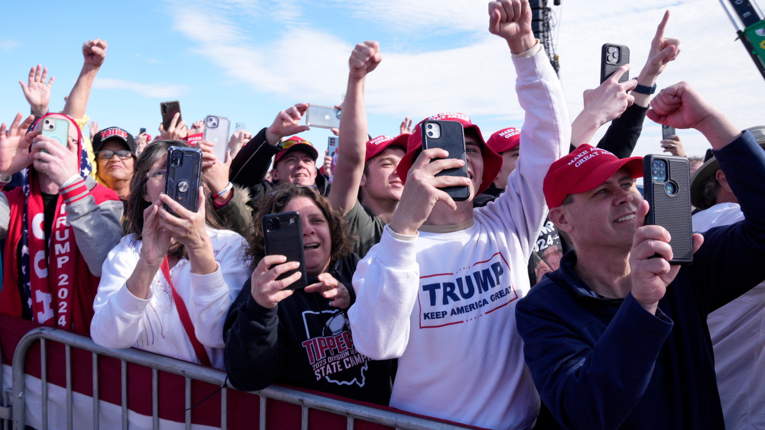 Supporters react as Republican presidential candidate former President Donald Trump arrives at a campaign rally Saturday, March 16, 2024, in Vandalia, Ohio. (AP Photo/Jeff Dean)