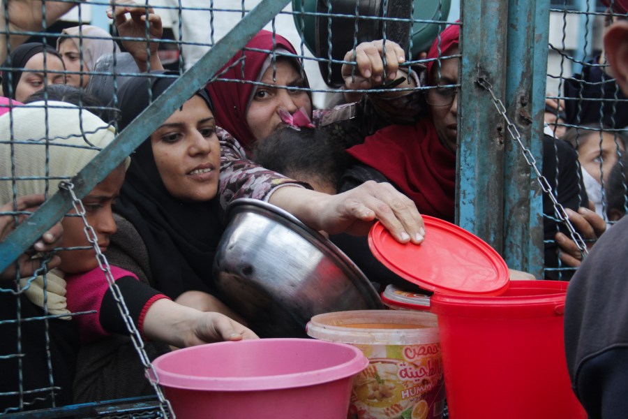 Palestinians line up to receive free meals at Jabaliya refugee camp in the Gaza Strip on Monday, March 18, 2024. (AP Photo/Mahmoud Essa)