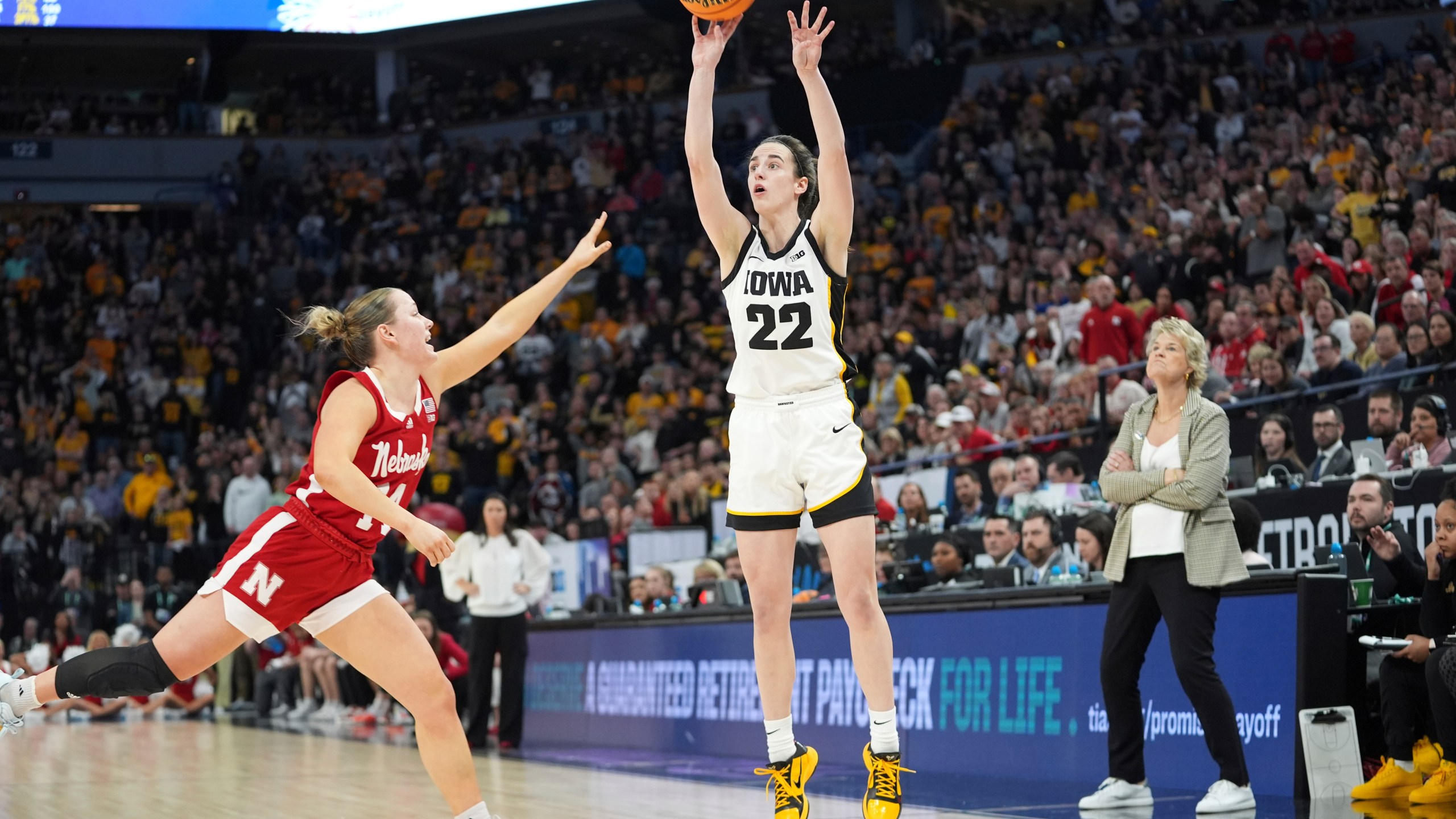 Iowa guard Caitlin Clark (22) shoots over Nebraska guard Callin Hake during overtime of an NCAA college basketball game in the final of the Big Ten women's tournament Sunday, March 10, 2024, in Minneapolis. (AP Photo/Abbie Parr)