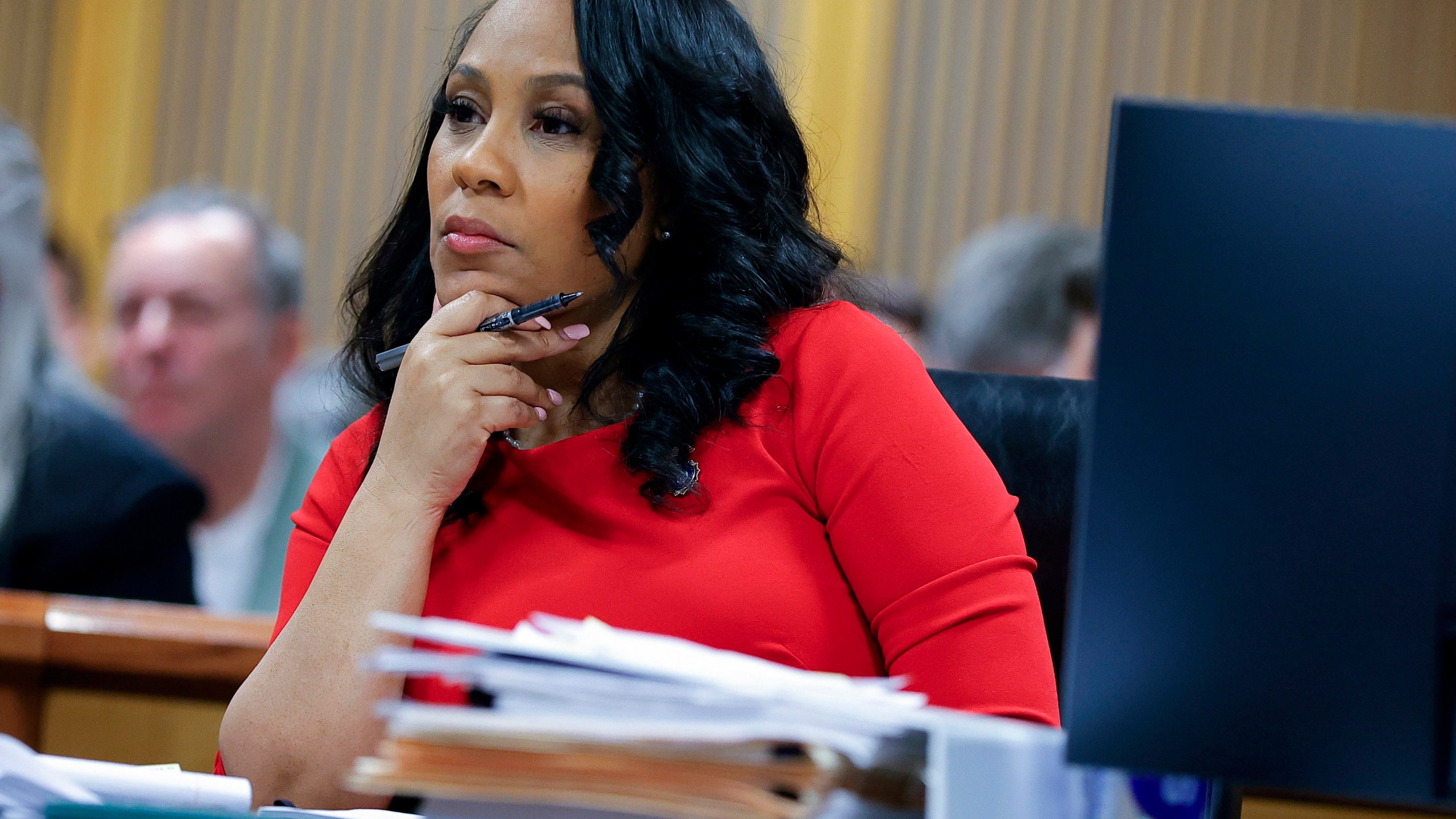 FILE - Fulton County District Attorney Fani Willis looks on during a hearing on the Georgia election interference case, Friday, March, 1, 2024, in Atlanta. An attorney for Donald Trump says he’s optimistic an appellate review will lead to the Georgia 2020 election interference case against him being dismissed and Fulton County District Attorney Fani Willis being disqualified. (AP Photo/Alex Slitz, Pool, File)