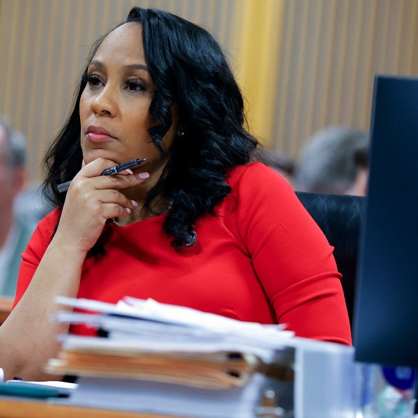 FILE - Fulton County District Attorney Fani Willis looks on during a hearing on the Georgia election interference case, Friday, March, 1, 2024, in Atlanta. An attorney for Donald Trump says he’s optimistic an appellate review will lead to the Georgia 2020 election interference case against him being dismissed and Fulton County District Attorney Fani Willis being disqualified. (AP Photo/Alex Slitz, Pool, File)