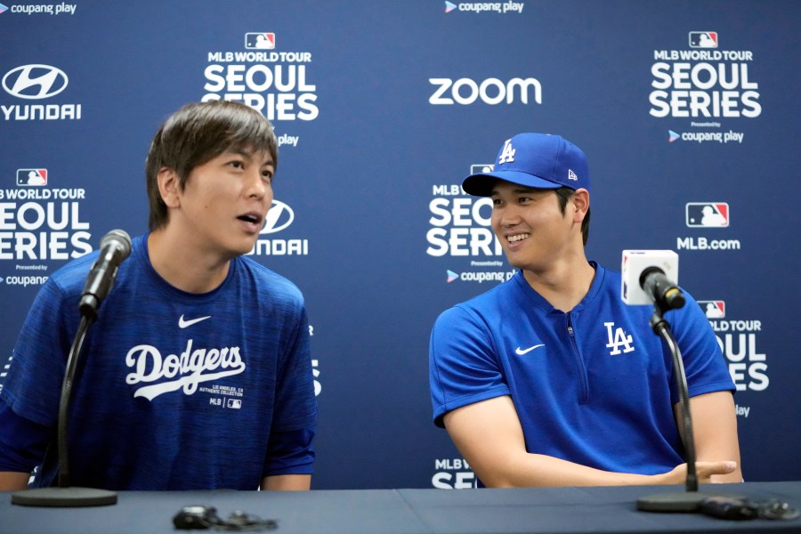 Los Angeles Dodgers' Shohei Ohtani, right, and his interpreter, Ippei Mizuhara, attend at a news conference ahead of a baseball workout at Gocheok Sky Dome in Seoul, South Korea, Saturday, March 16, 2024. Ohtani’s interpreter and close friend has been fired by the Dodgers following allegations of illegal gambling and theft from the Japanese baseball star. (AP Photo/Lee Jin-man)