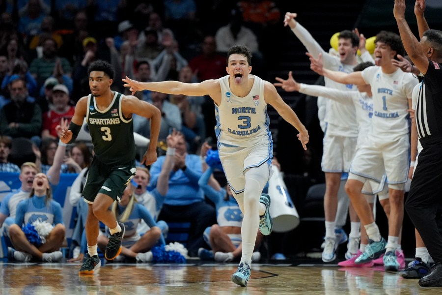 North Carolina guard Cormac Ryan (3) celebrates after scoring against Michigan State during the second half of a second-round college basketball game in the NCAA Tournament, Saturday, March 23, 2024, in Charlotte, N.C. (AP Photo/Chris Carlson)