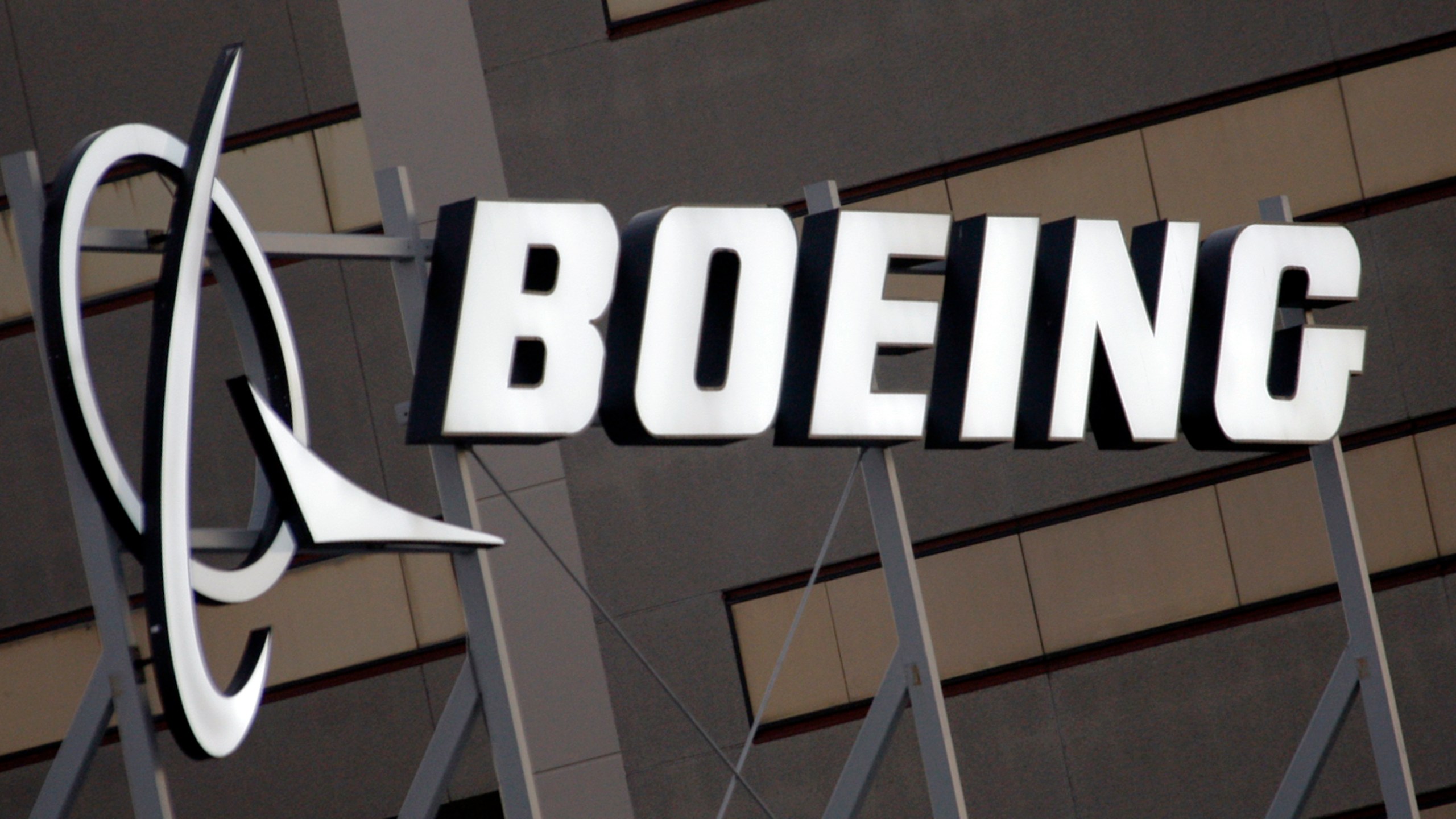 FILE - The Boeing logo is seen, Jan. 25, 2011, on the property in El Segundo, Calif. The American plane maker has been under intense pressure since early January, when a panel blew off a brand-new Alaska Airlines 737 Max midflight. That's spotlighted a lengthy series of safety and manufacturing problems that have piled up for Boeing over the years — including two devastating crashes that also involved Max jets. On Monday, March 25, 2024 Boeing announced that CEO David Calhoun would be stepping down from his post at the end of the year as part of broader management changes. (AP Photo/Reed Saxon, File)