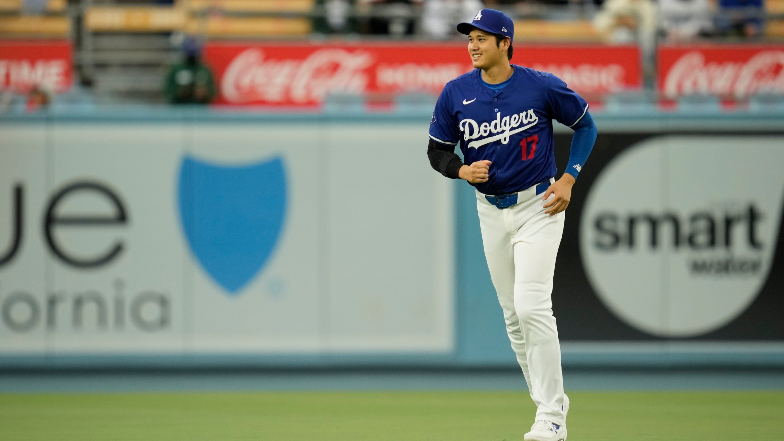 Los Angeles Dodgers designated hitter Shohei Ohtani (17) warms up before a spring training baseball game against the Los Angeles Angels in Los Angeles, Sunday, March 24, 2024. (AP Photo/Ashley Landis)