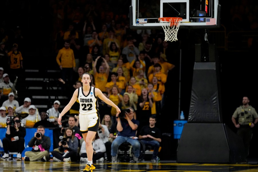 Iowa guard Caitlin Clark (22) reacts after making a three-point basket in the second half of a second-round college basketball game against West Virginia in the NCAA Tournament, Monday, March 25, 2024, in Iowa City, Iowa. (AP Photo/Charlie Neibergall)