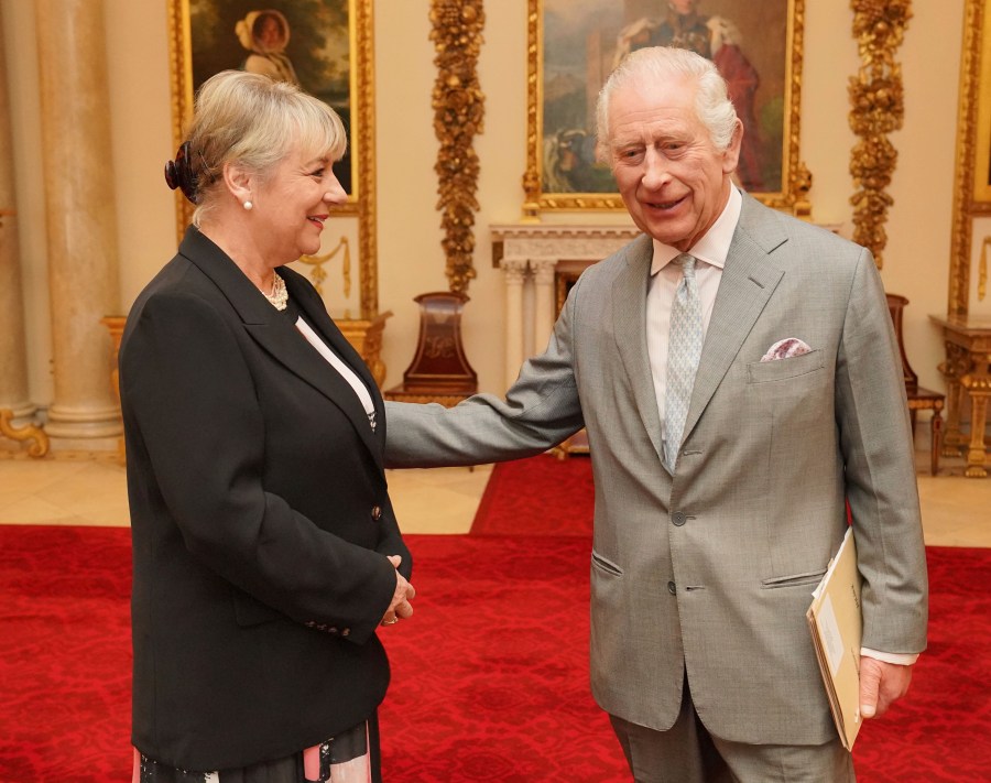 Britain's King Charles III greets Dame Martina Milburn prior to an audience in the Billiard Room at Buckingham Palace, London, on Tuesday March 26, 2024 with community faith leaders from across the UK who have taken part in a Windsor Leadership Trust programme, encouraging and supporting dialogue, harmony and understanding at a time of heightened international tension. (Jonathan Brady, Pool Photo via AP)