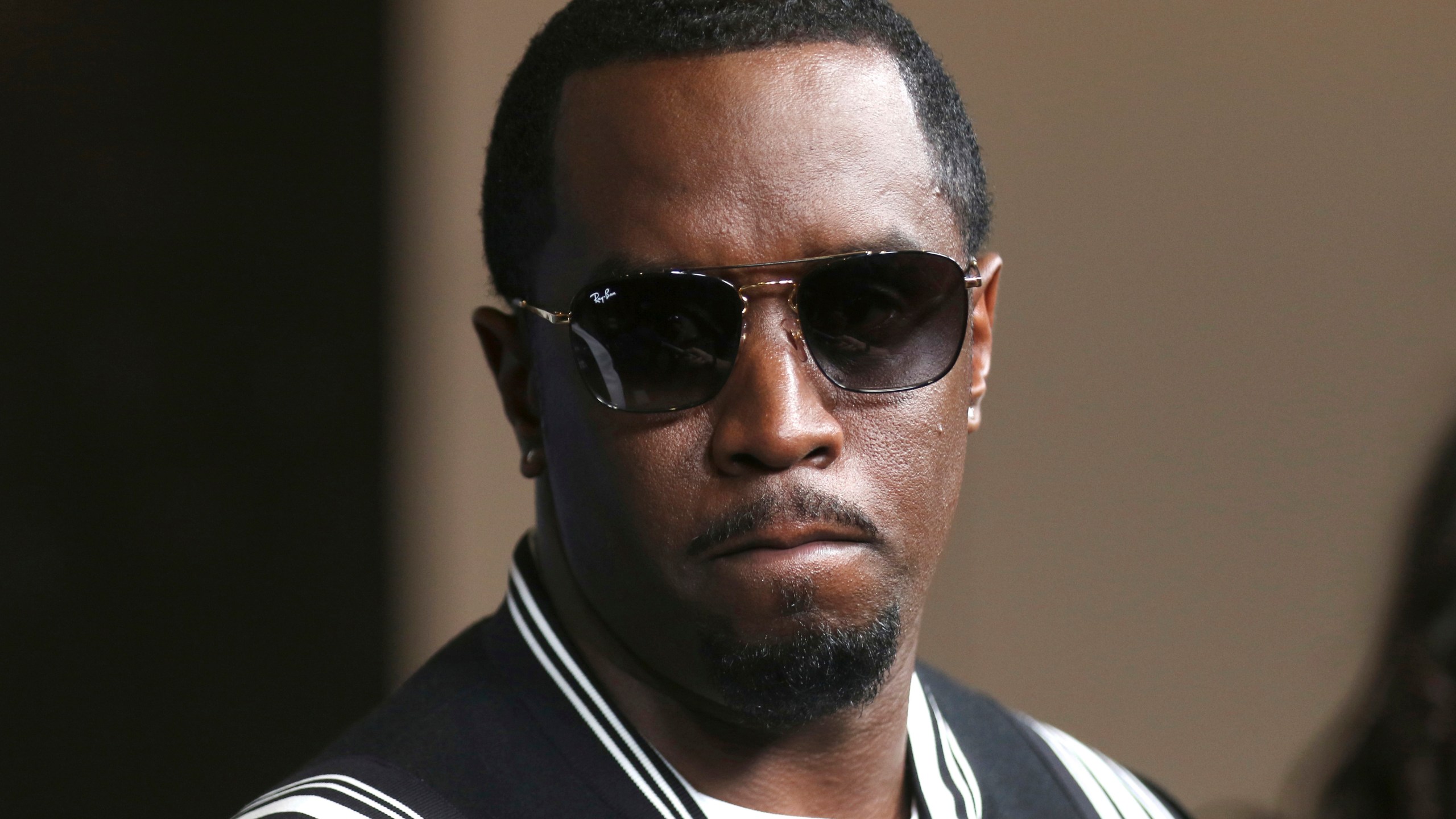 FILE - In this May 30, 2018, file photo, Sean "Diddy" Combs arrives at the LA Premiere of "The Four: Battle For Stardom" at the CBS Radford Studio Center in Los Angeles. Combs' lawyer said Tuesday, March 26, 2024, that the searches of his Los Angeles and Miami properties by federal authorities in a sex-trafficking investigation were ”a gross use of military-level force" and that Combs is “innocent and will continue to fight" to clear his name. (Photo by Willy Sanjuan/Invision/AP, File)